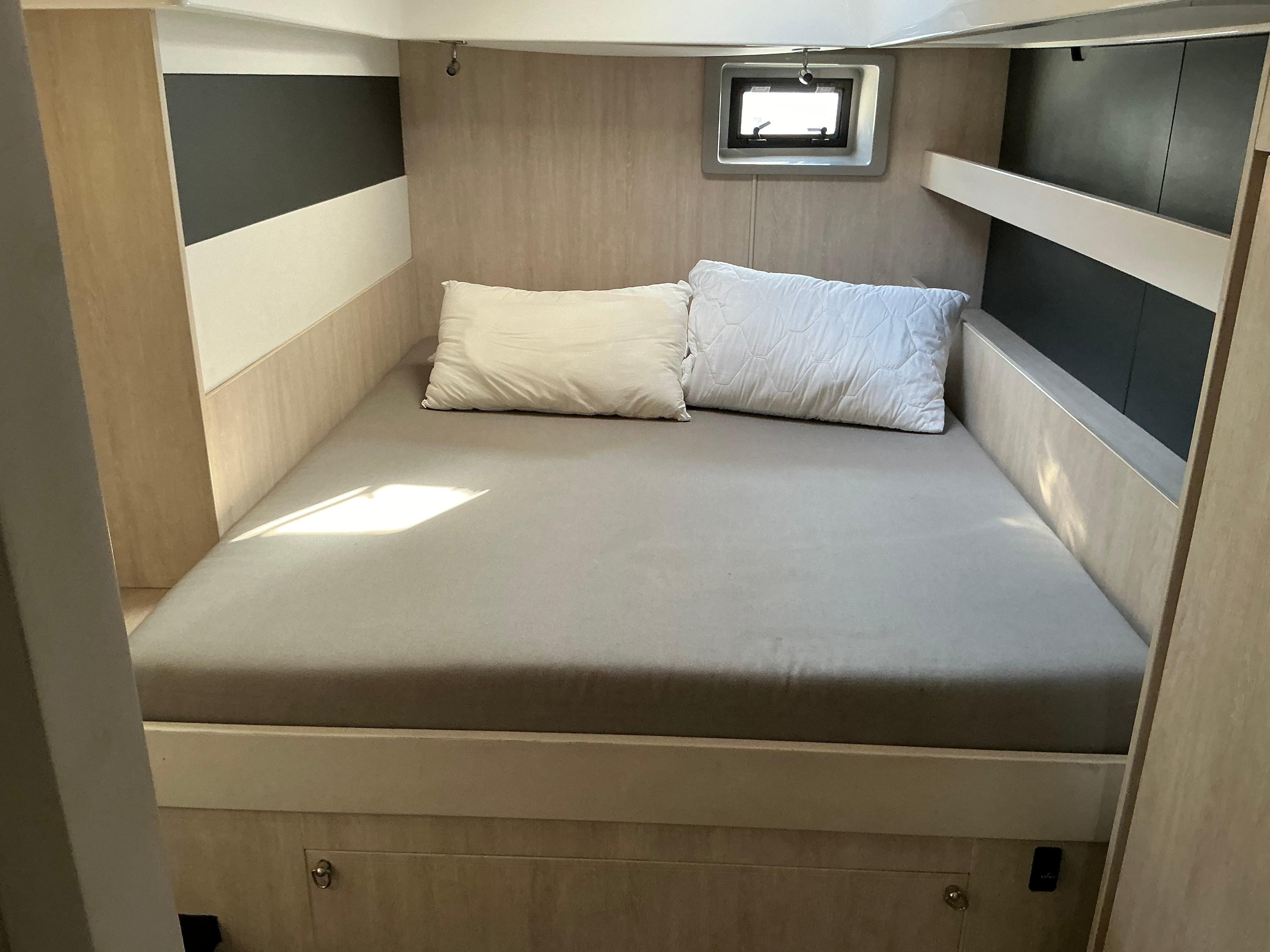 Cozy bedroom interior of 2019 Leopard 51 Powercat with modern design and natural light.