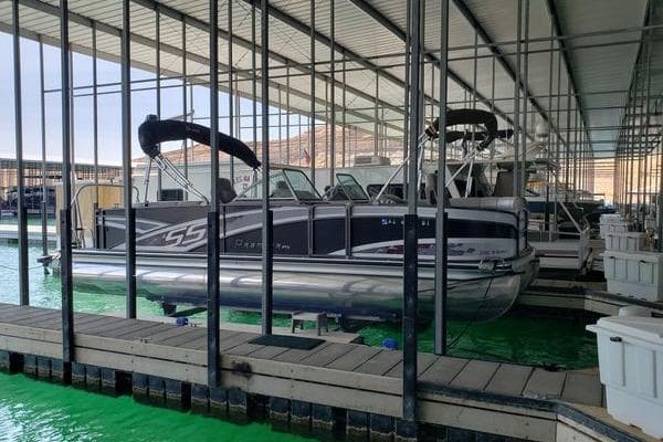2014 Premier Yachts 250 S-Series RF pontoon boat docked in a marina.