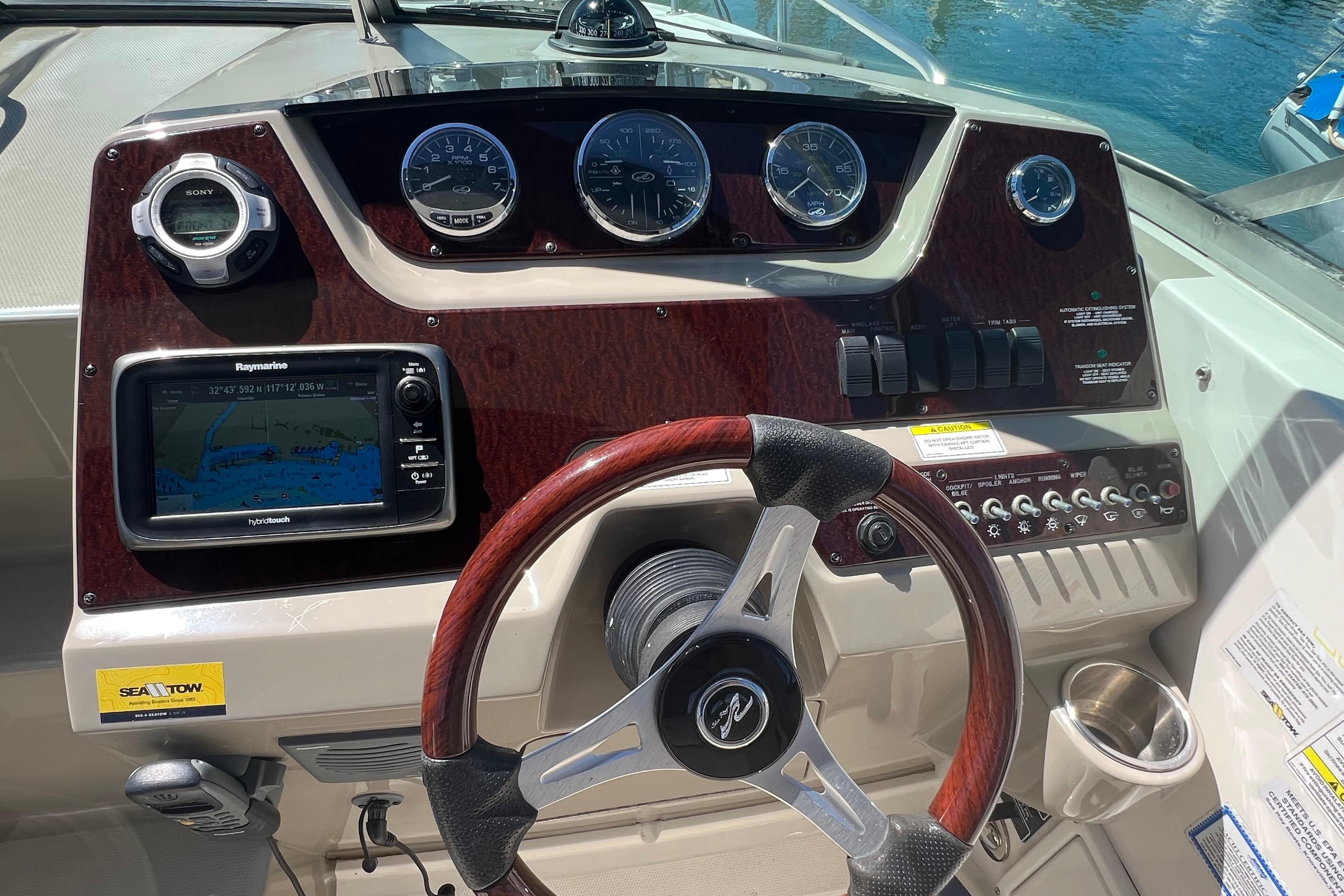Dashboard of 2013 Sea Ray Sundancer 280 with navigation system and controls.