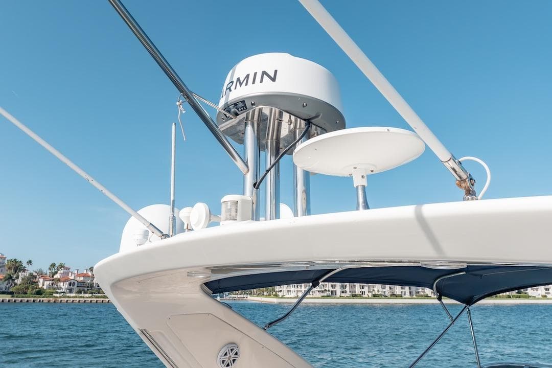 2007 Azimut 62 Evolution yacht with Garmin radar, clear blue sky background.