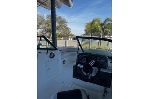 2023 Hurricane SunDeck Sport 188 OB boat interior with steering wheel and dashboard.
