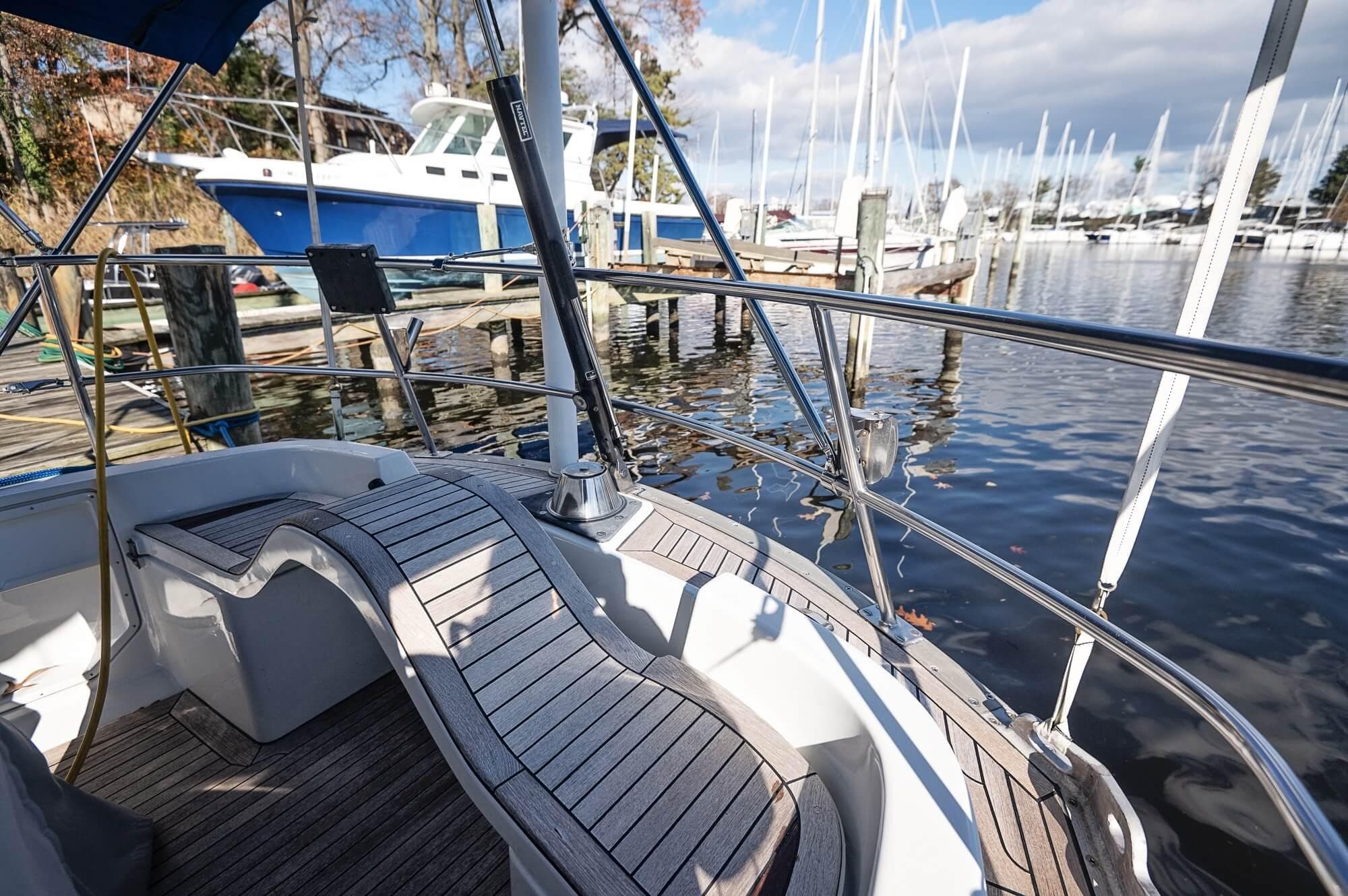 Cockpit view of a 1977 Baltic 42 sailboat docked at a marina.