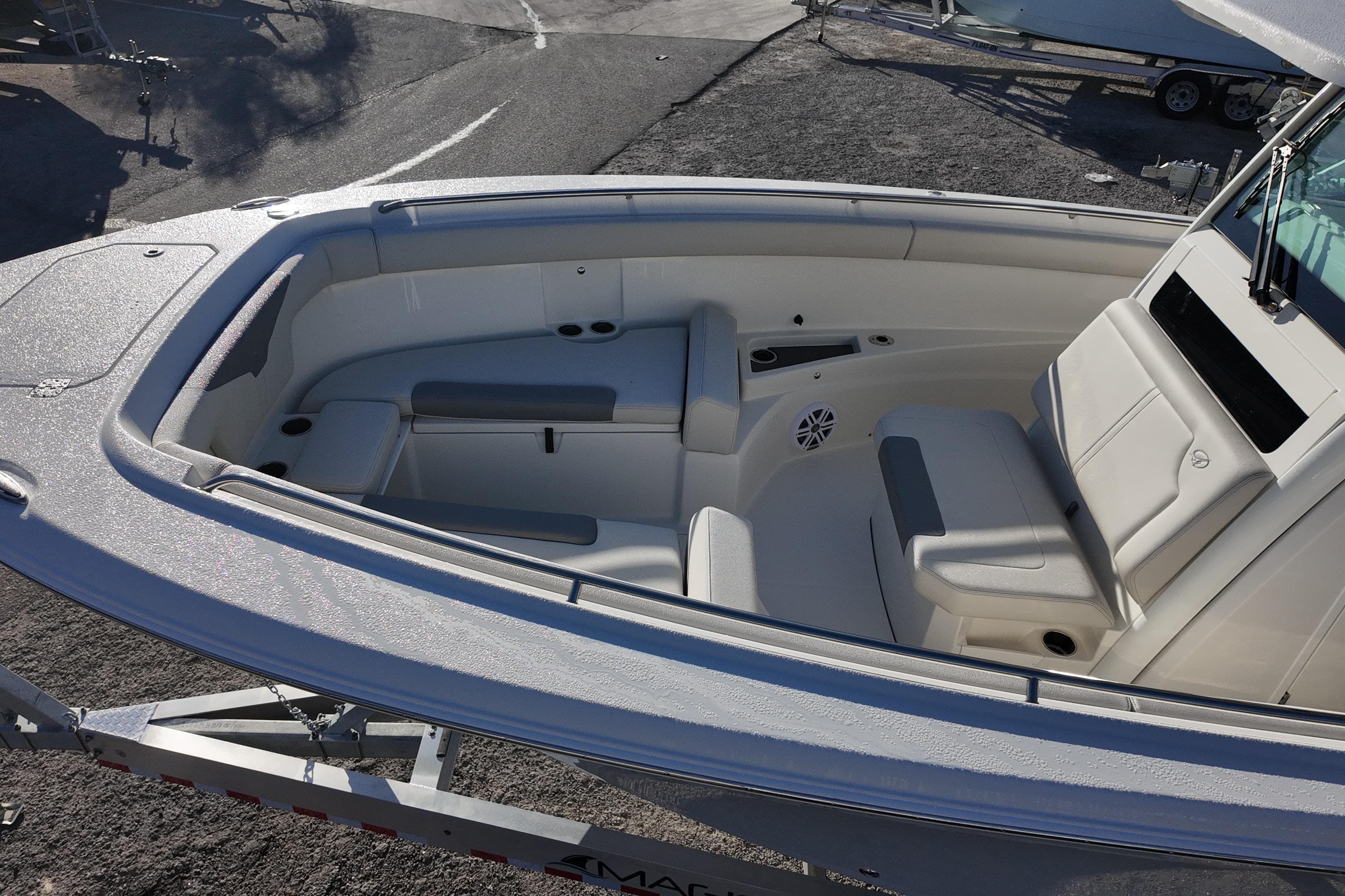 2026 Sailfish 272 CC boat interior with cushioned seating and cup holders.