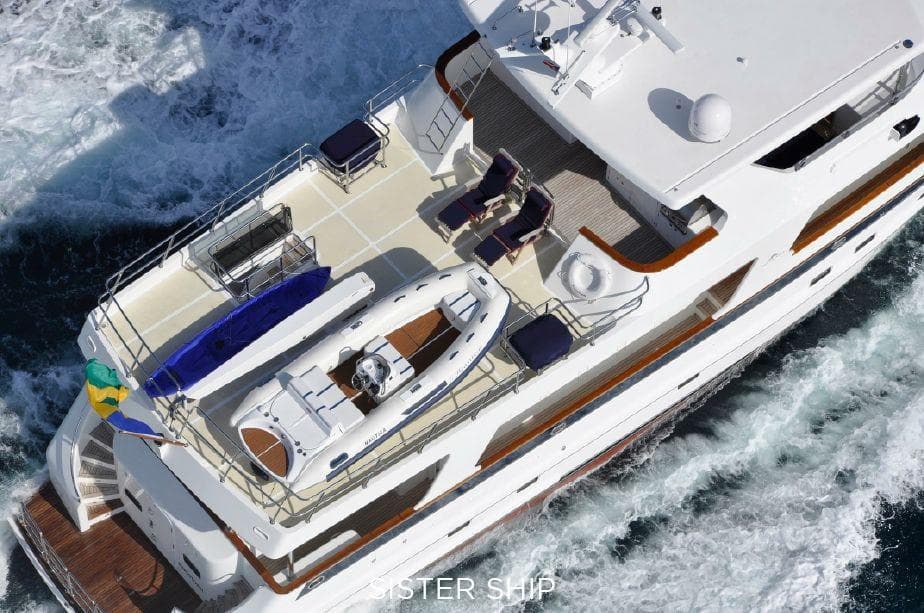 Aerial view of 2027 Outer Reef Yachts 800 Motoryacht cruising on the ocean.
