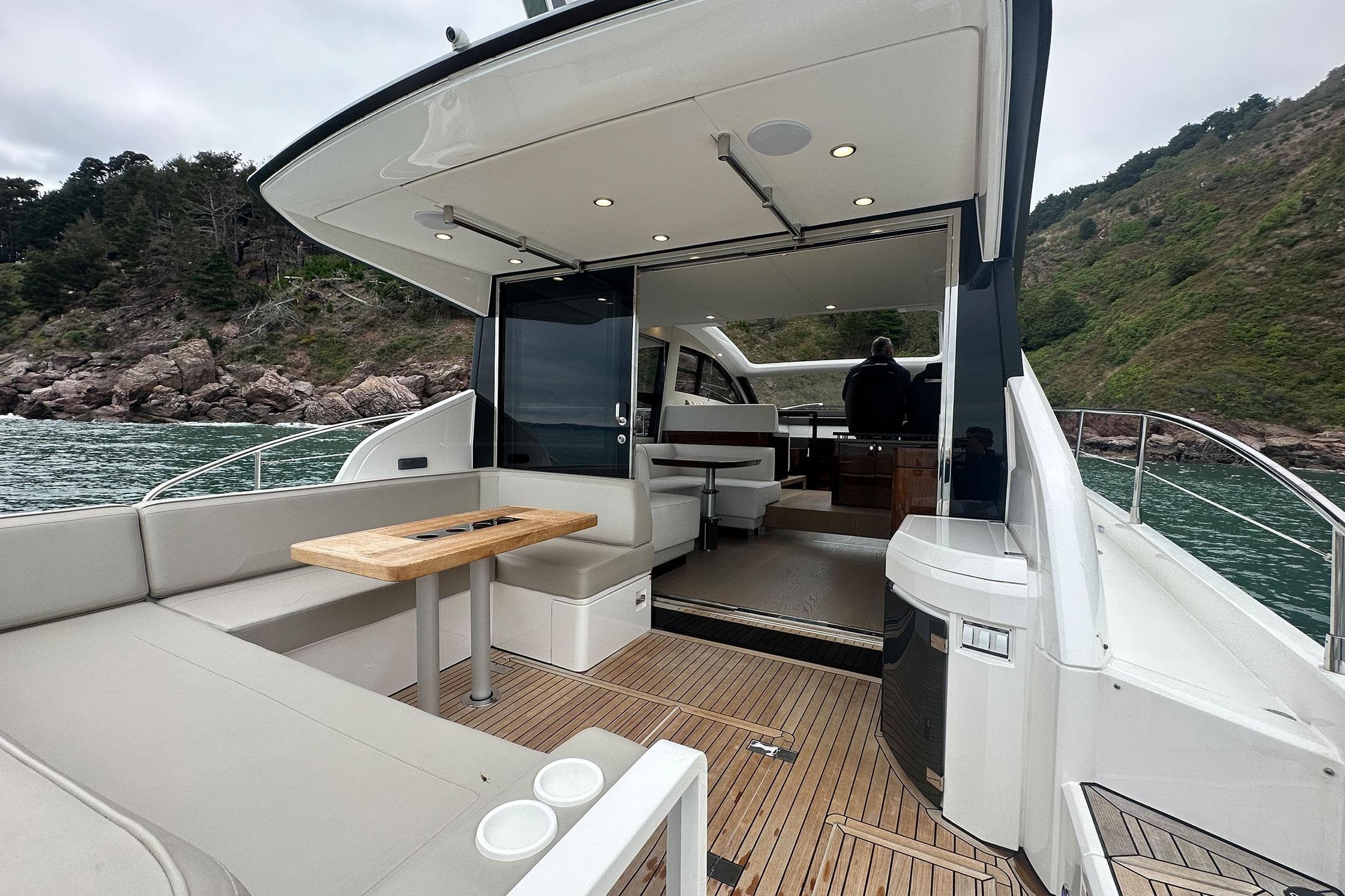 2022 Fairline Targa 50 GT yacht with spacious deck and luxurious interior on scenic water.