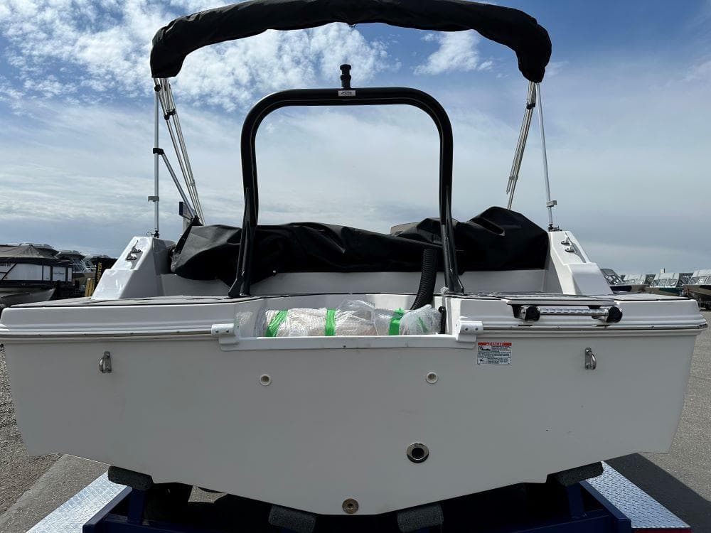 2024 Starcraft SVX 211 OB boat rear view with bimini top.