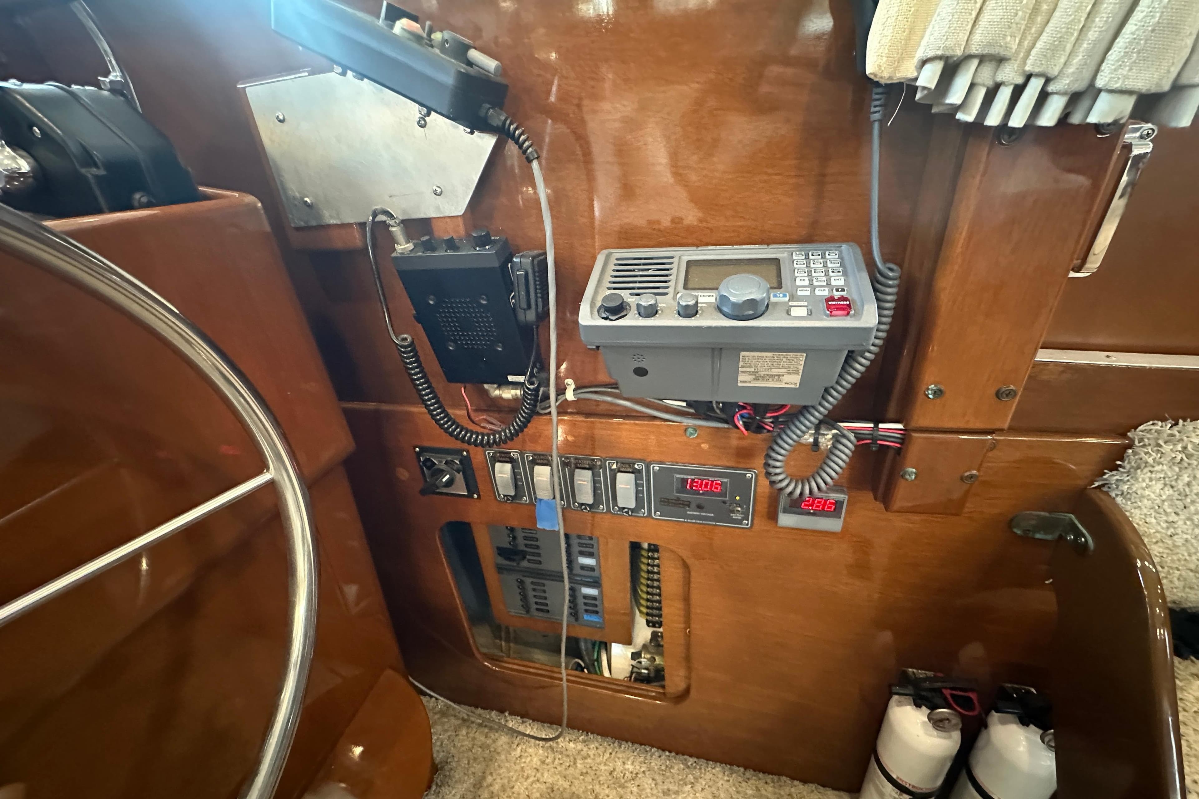 Interior view of a 1972 Tollycraft 42 Tri-Cabin with radio and control panel.