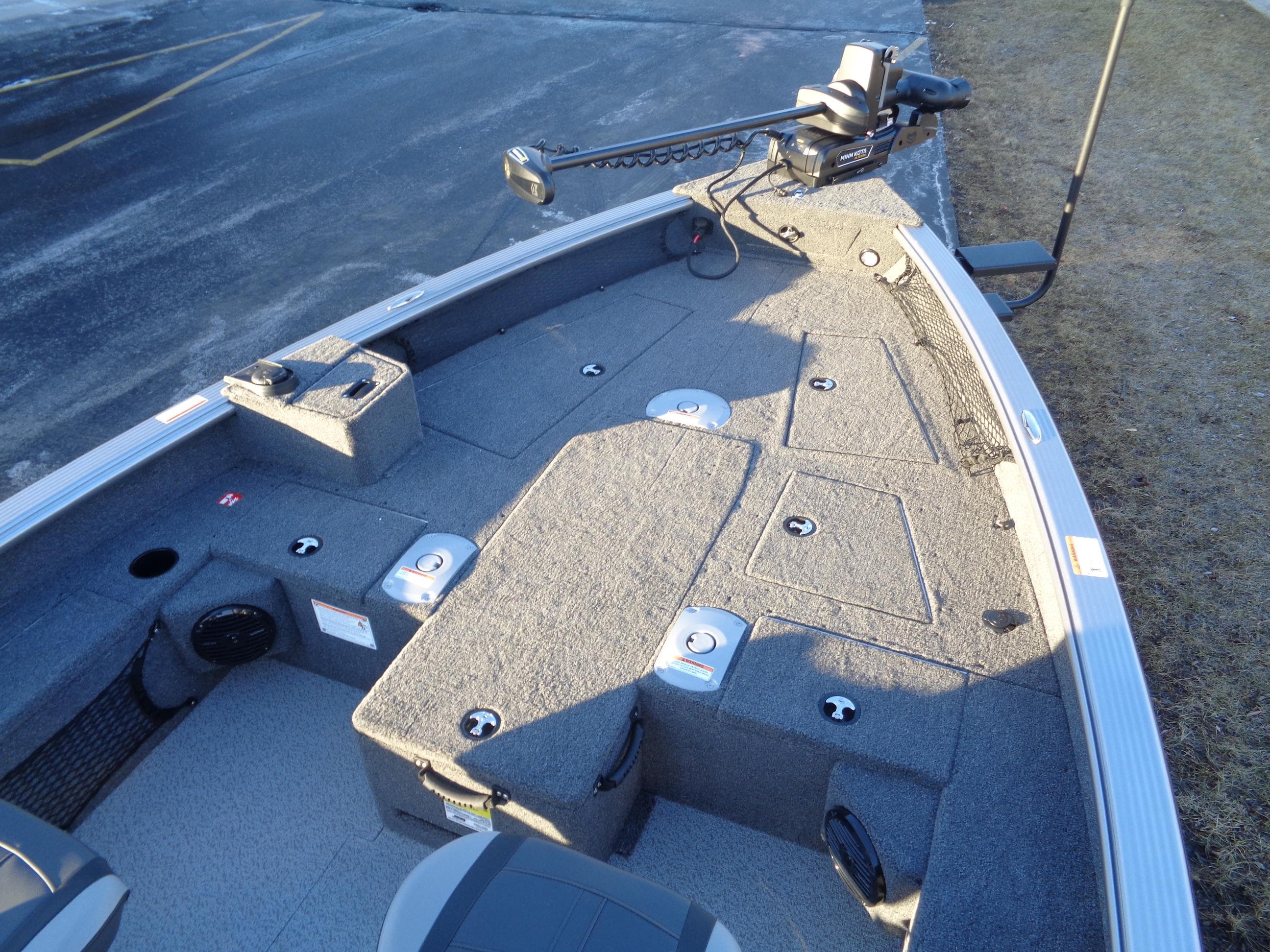 2025 Lund 1875 Pro Guide boat interior with fishing deck and trolling motor.
