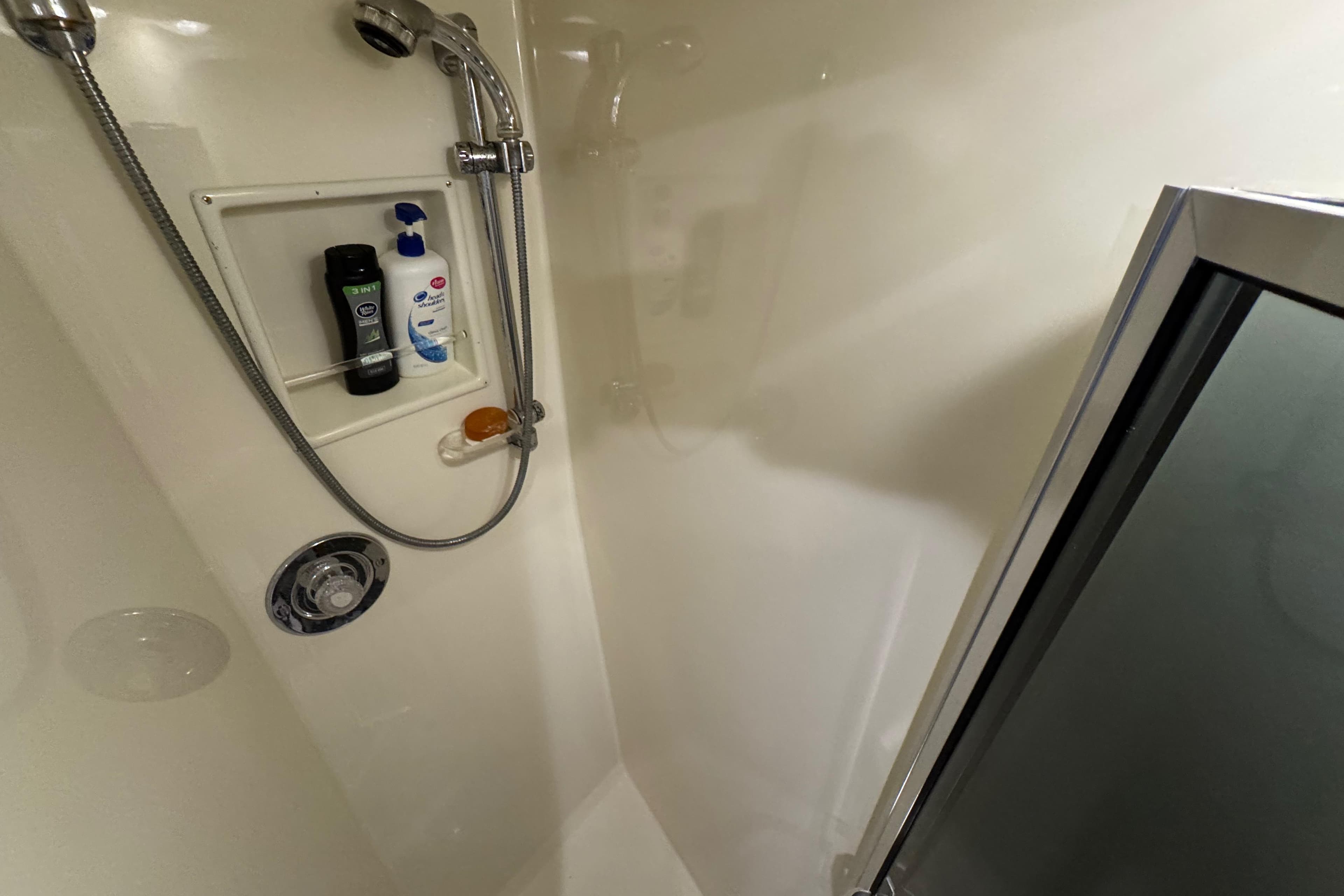 Shower area in 1995 Viking 58 Convertible yacht with toiletries and chrome fixtures.
