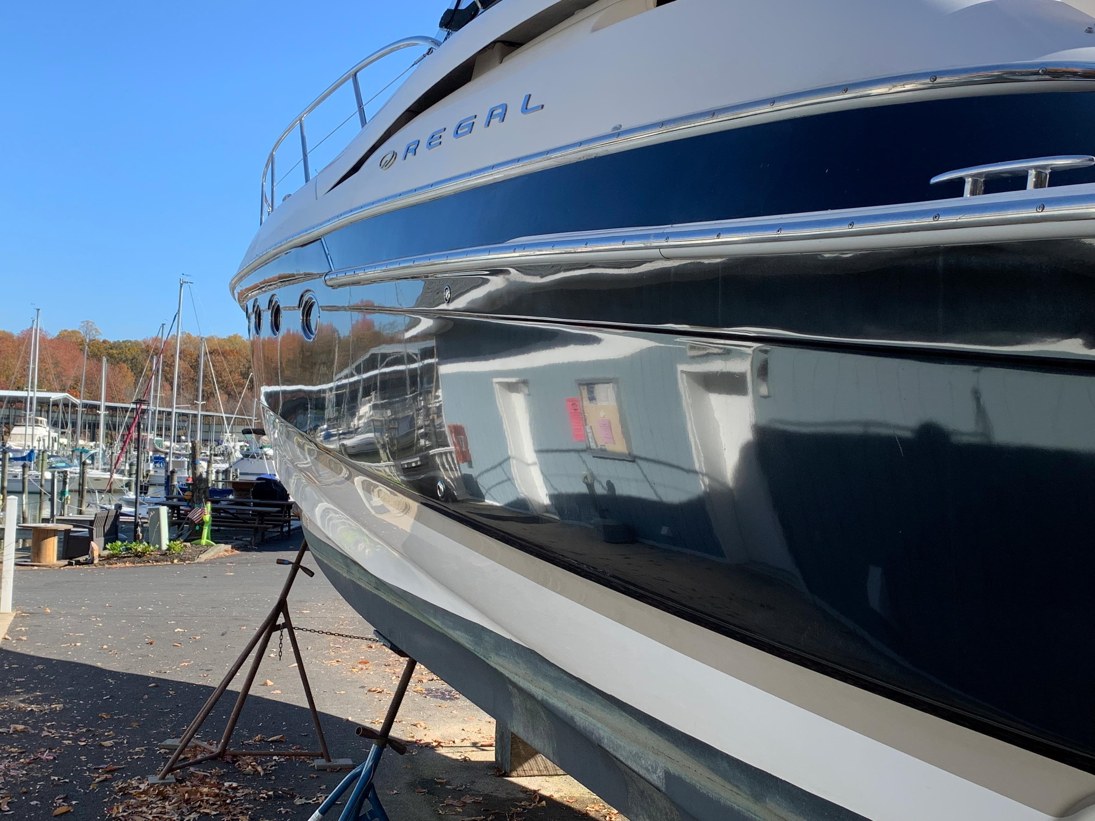 2009 Regal 4460 yacht docked at a marina.