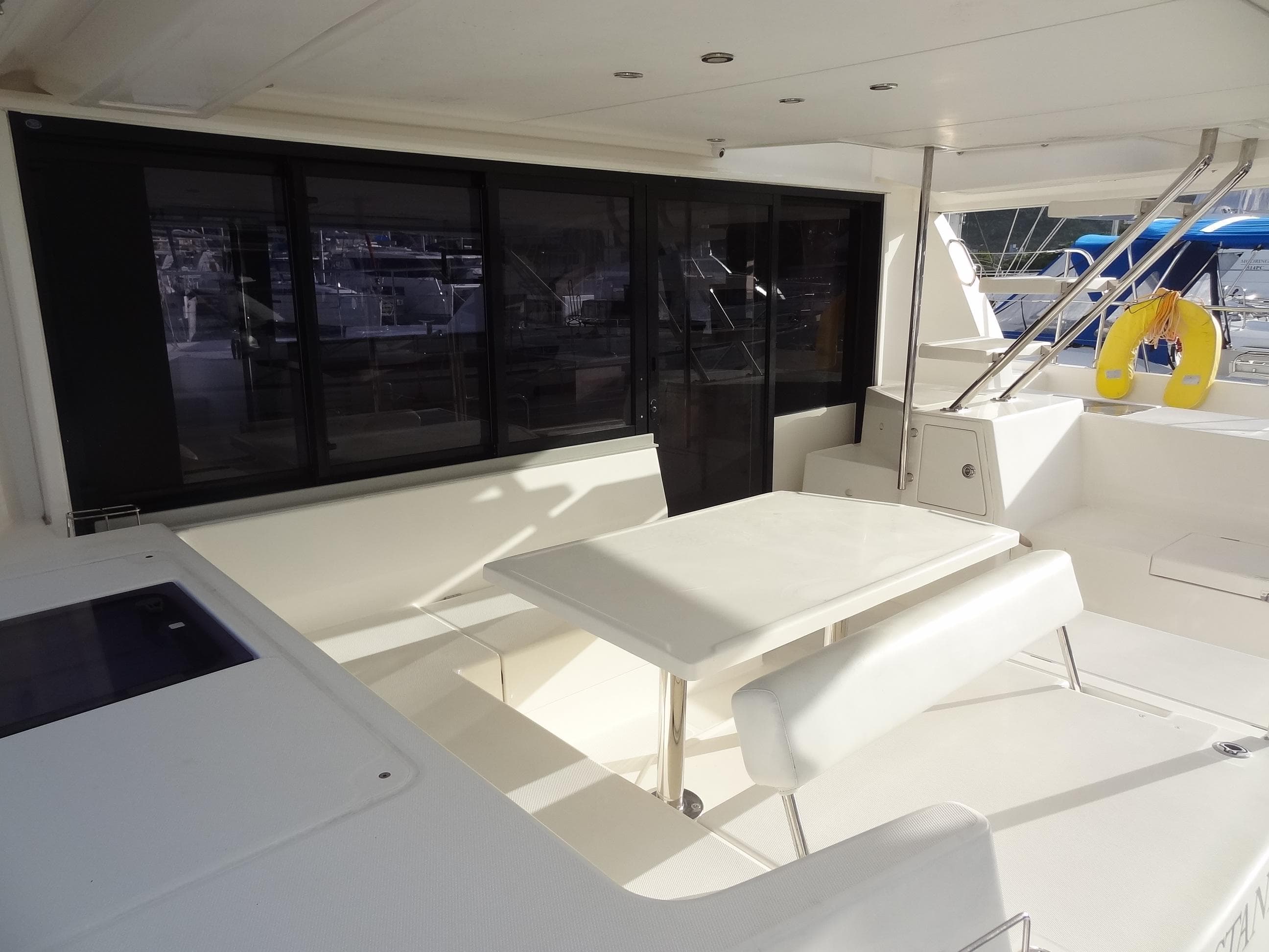 2017 Leopard 43 Powercat yacht interior with white seating and table.