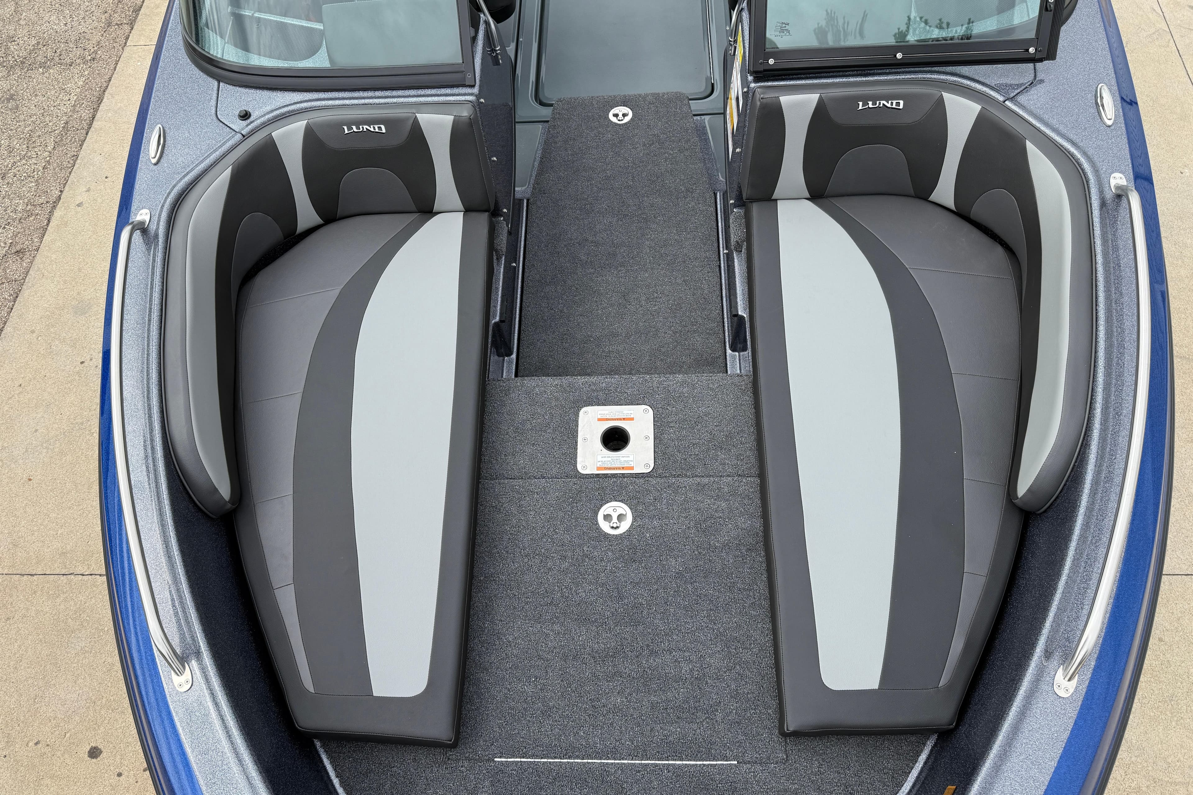 2026 Lund 189 Tyee GL boat interior with gray and black seating.