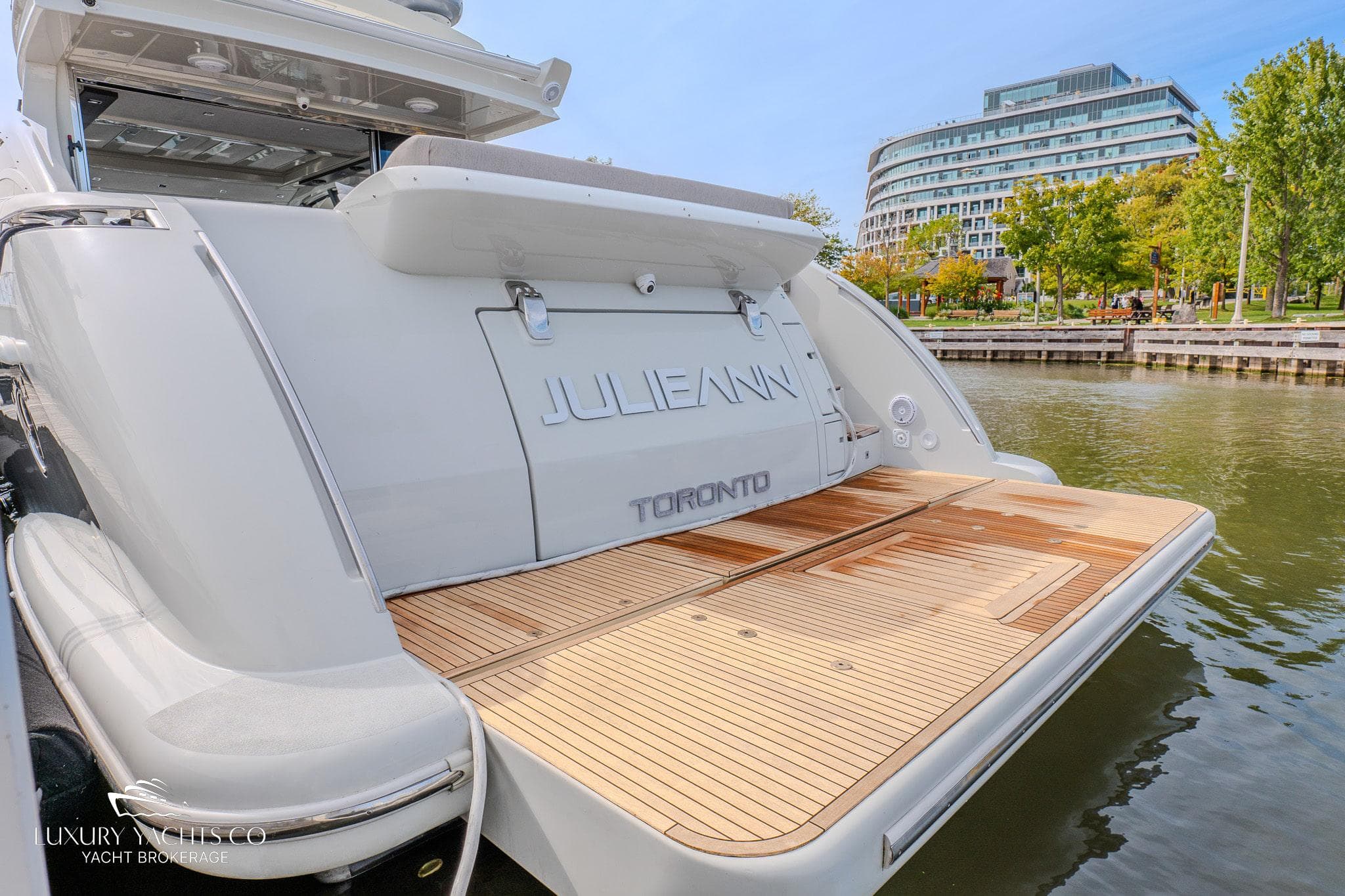 Azimut 62S yacht, 2010 model, docked in Toronto with spacious teak swim platform.