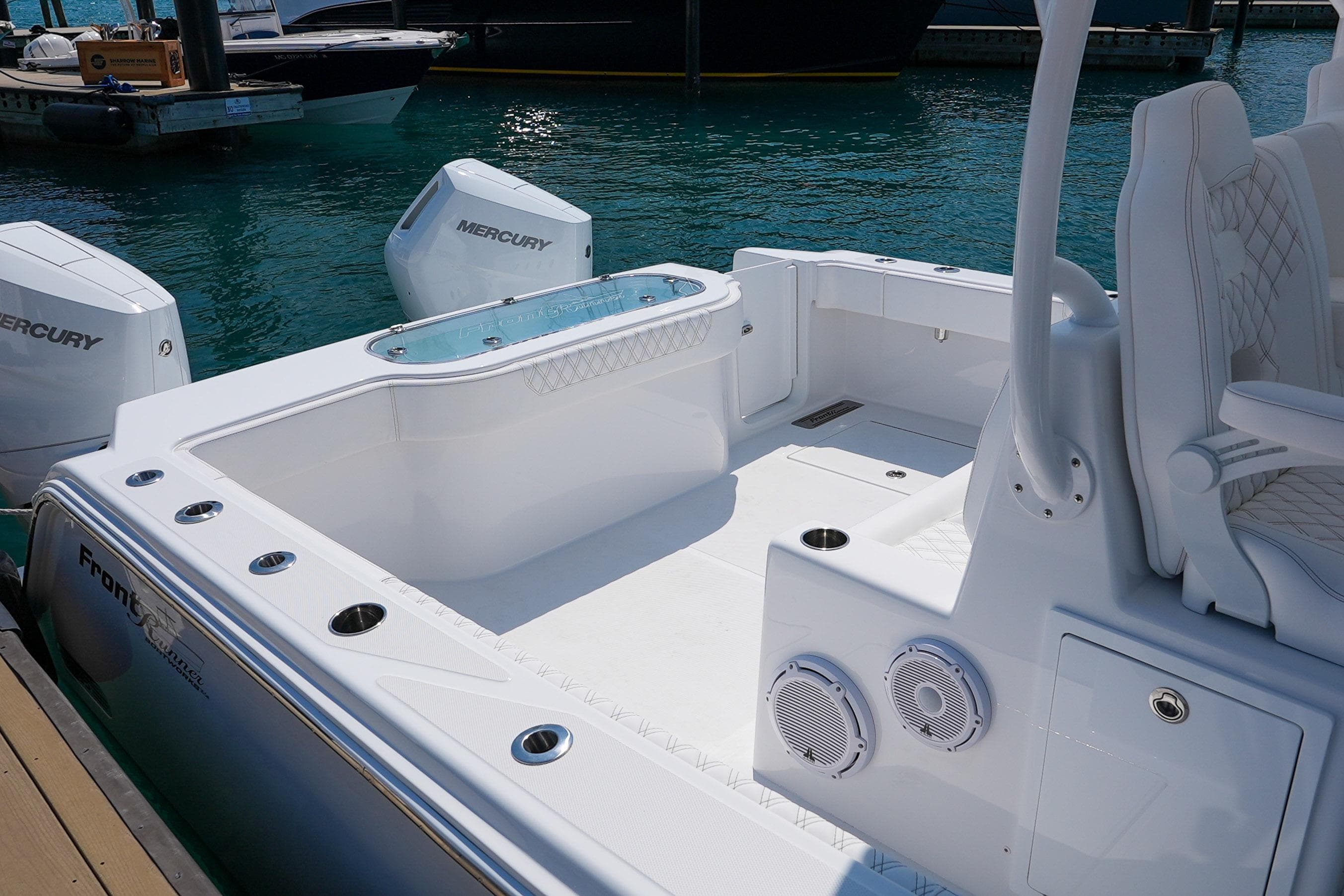2026 Front Runner 35 Catamaran with Mercury engines, docked in clear blue water.