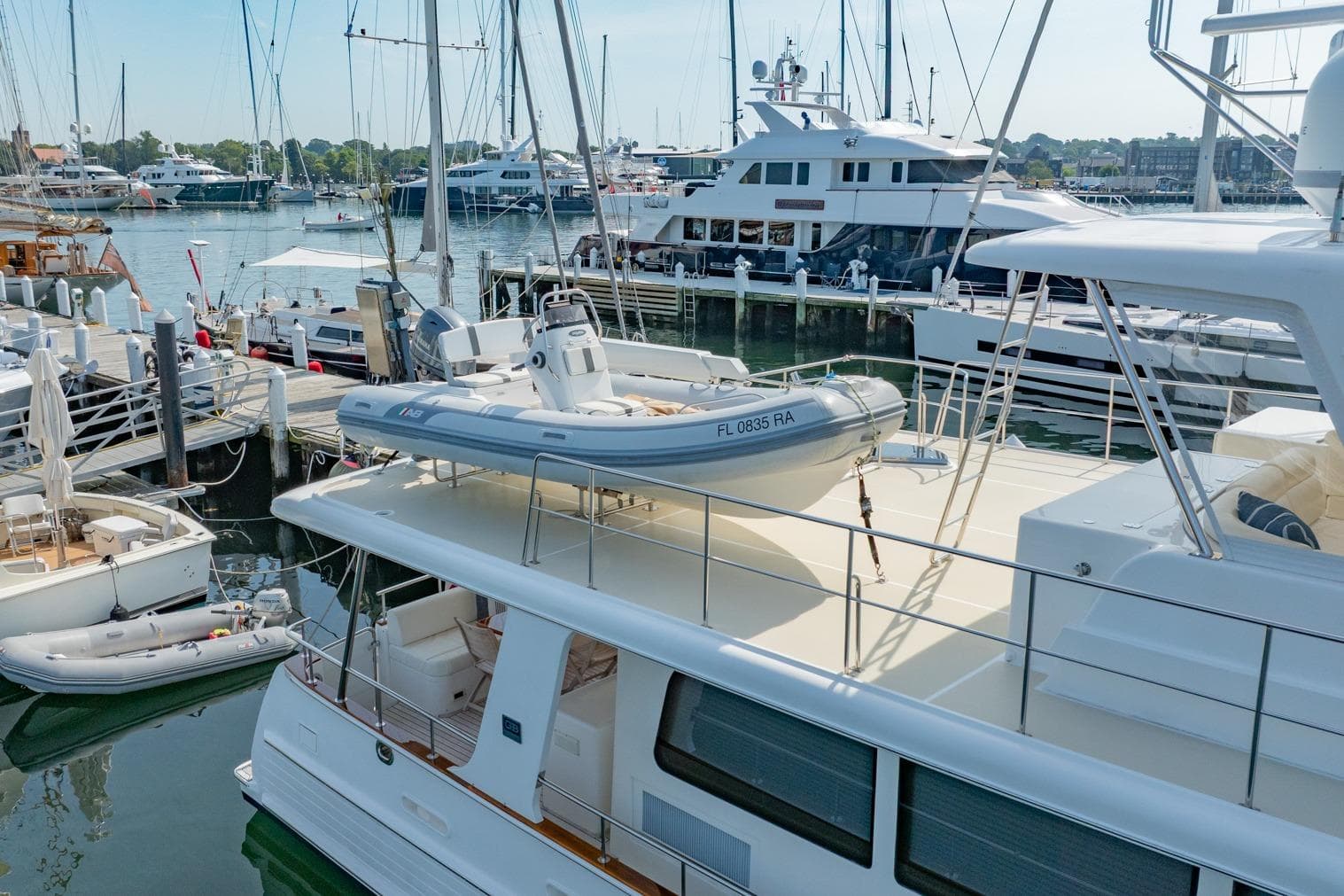 2016 Grand Banks 72 Aleutian RP yacht docked with tender on deck.