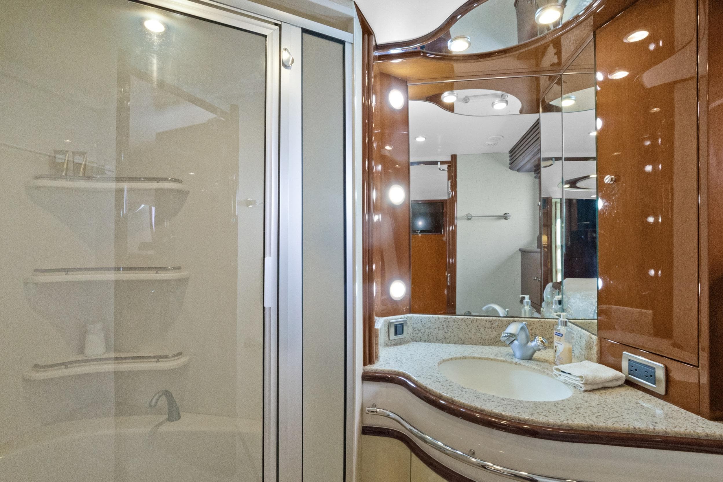 Luxurious bathroom in 2008 Marquis 690 yacht with elegant fixtures and modern design.