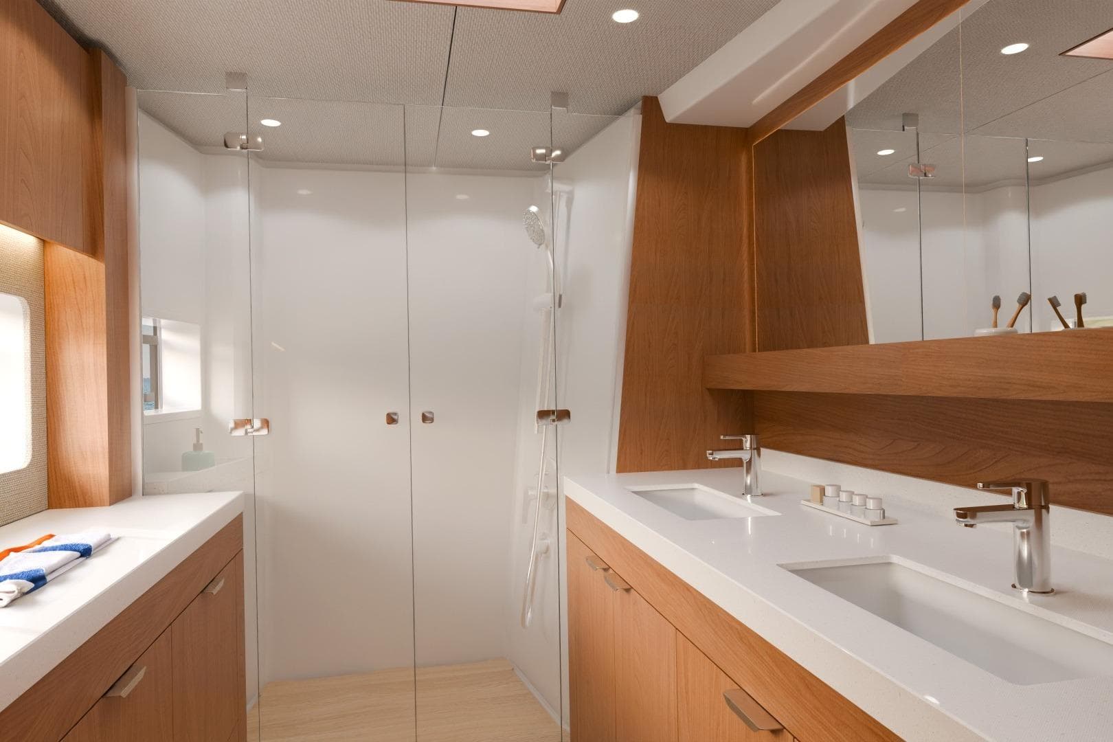 Modern yacht bathroom with dual sinks, wooden cabinetry, and glass shower in Bali 5.2, 2026 model.