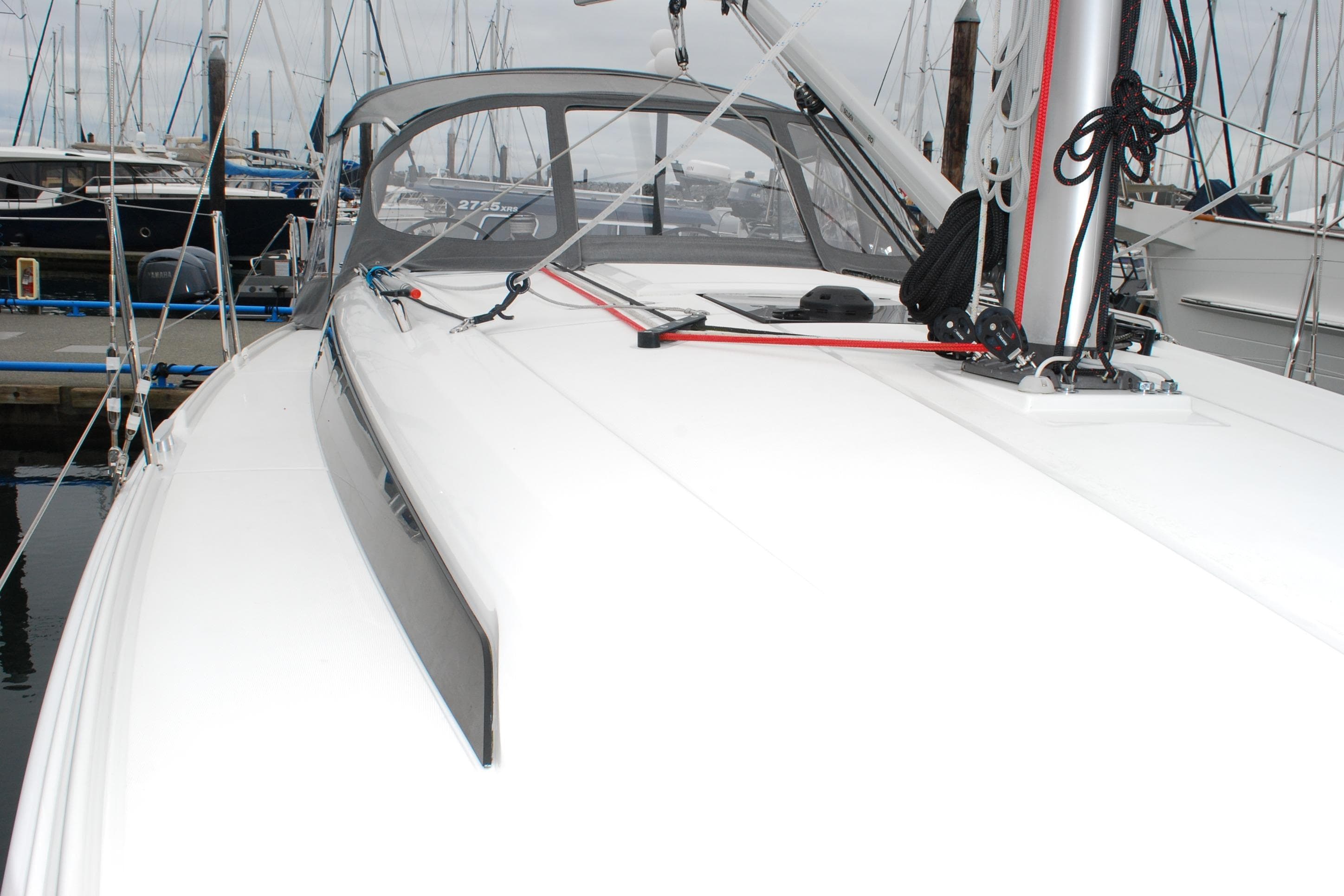 2023 Beneteau Oceanis 34.1 sailboat docked, showcasing sleek deck design and rigging.