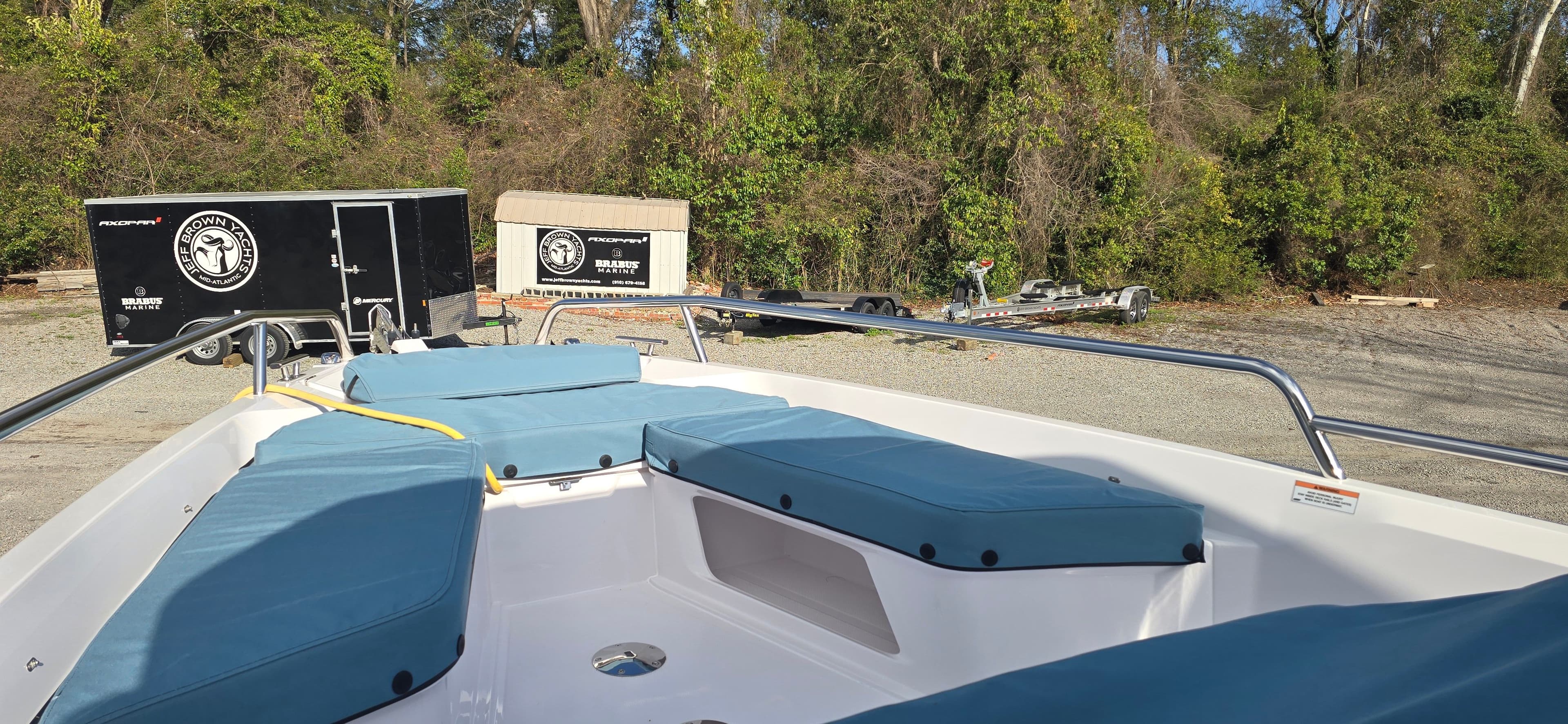 2024 Axopar 29 boat with blue cushions outdoors.