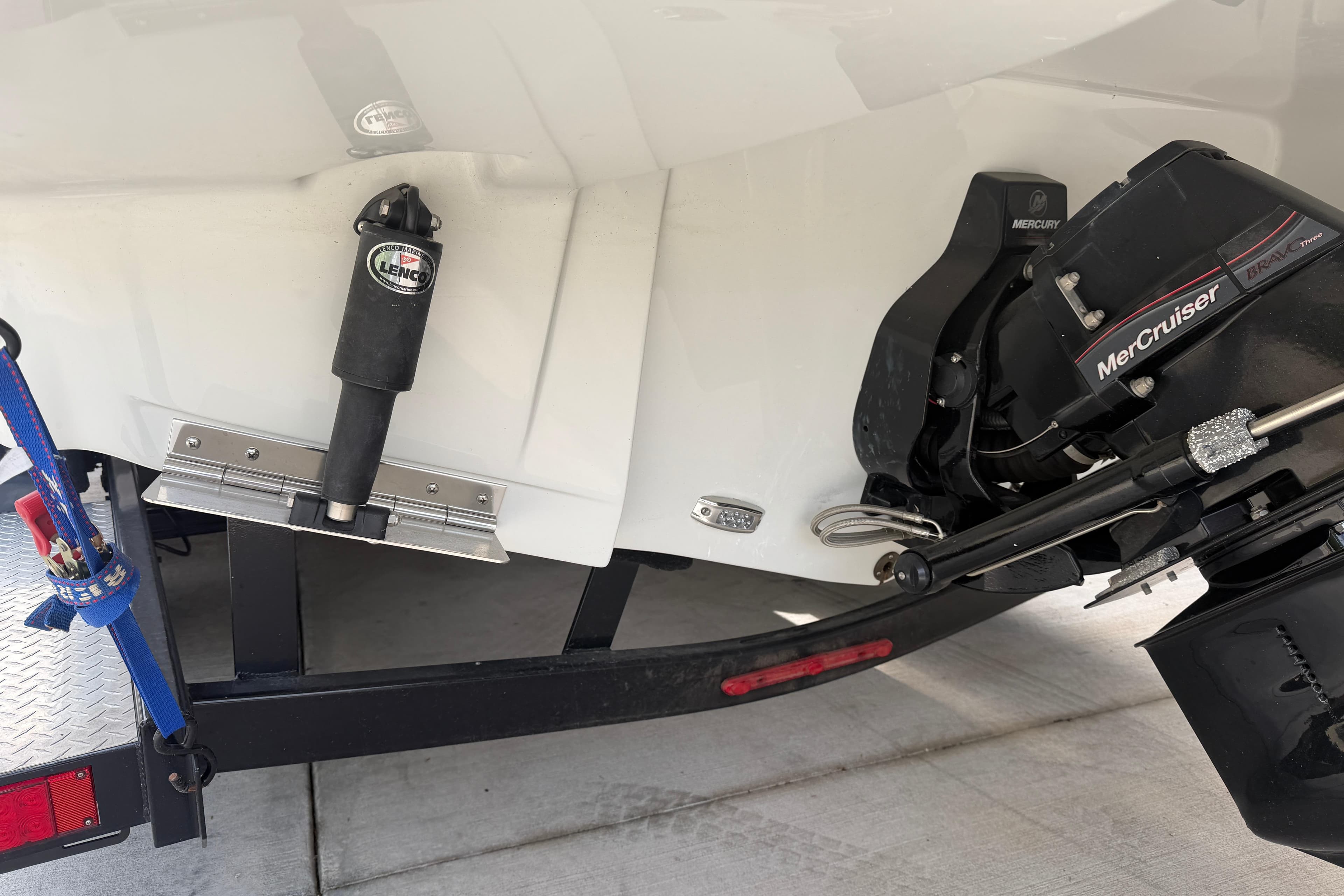 2023 Crownline 280 SS boat with MerCruiser engine and Lenco trim tab on trailer.
