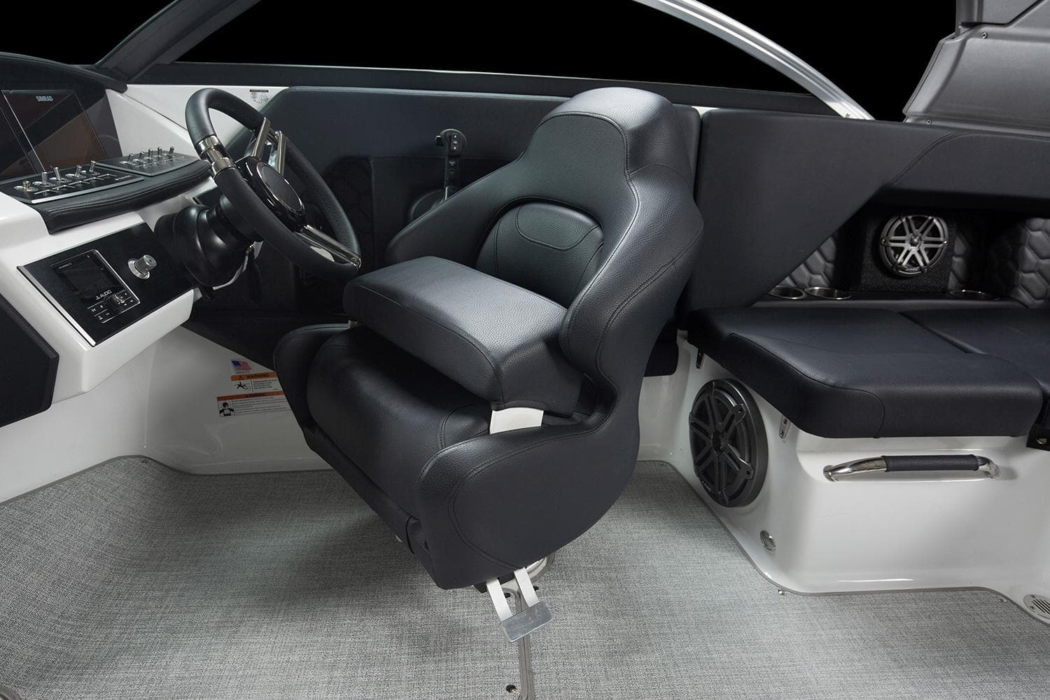 Manufacturer Provided Image: 2025 Four Winns H2 OB boat interior with black captain's chair and modern dashboard.