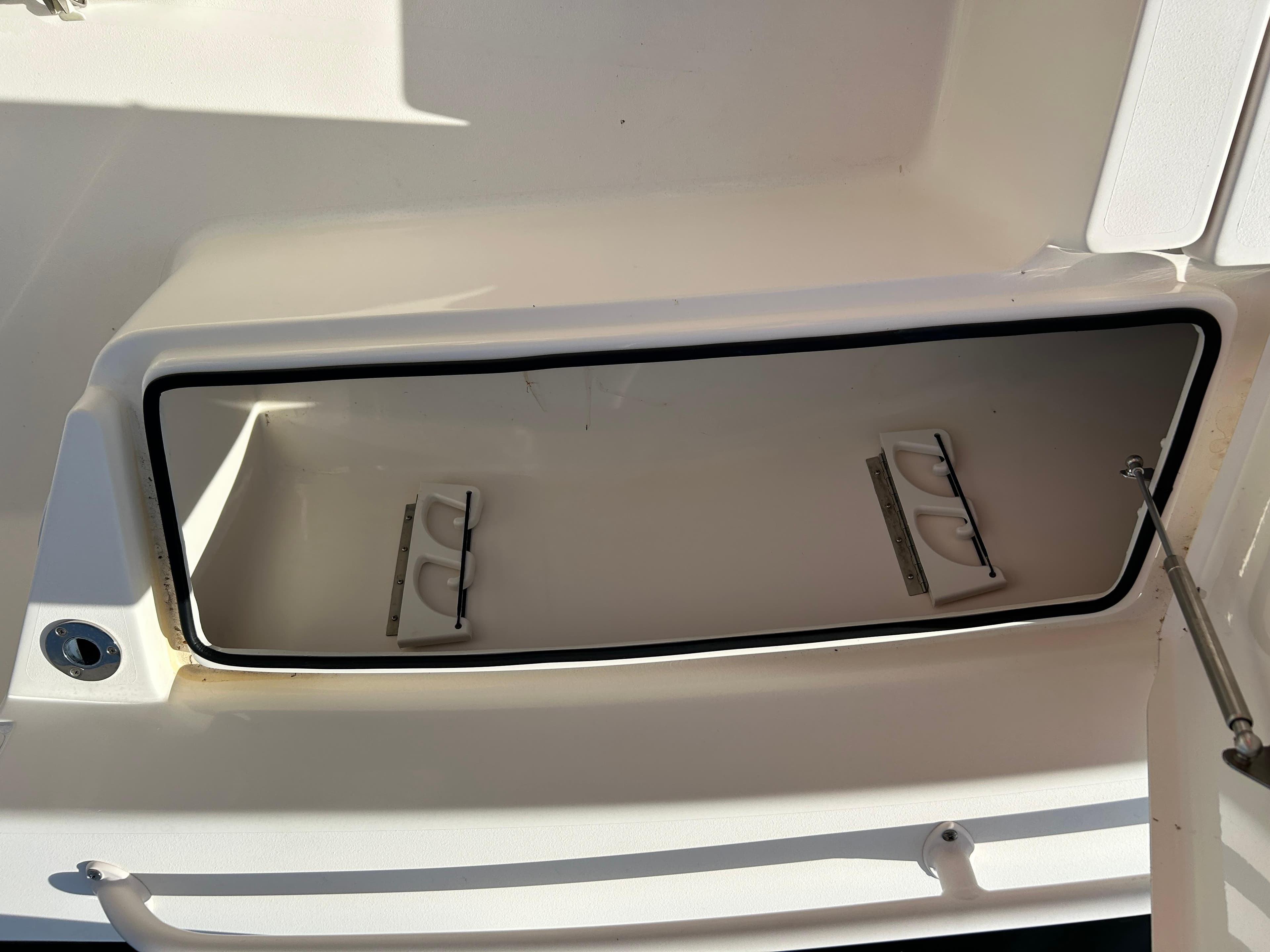 Open storage compartment on a 2019 Pathfinder 2200 CC boat.