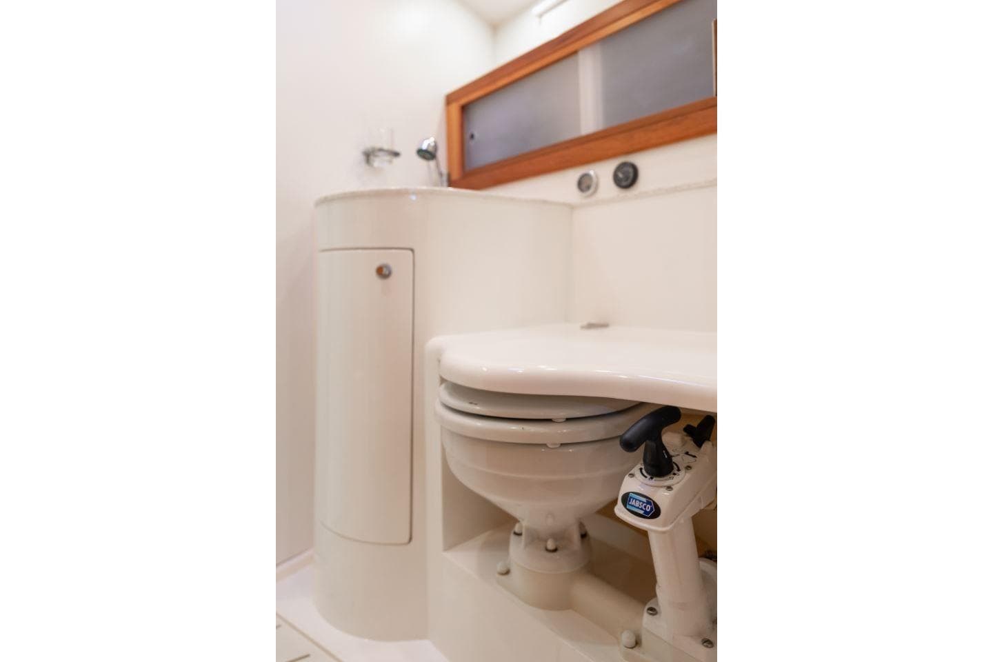 Bathroom interior of 2013 Southerly 42RST yacht, featuring compact marine toilet.