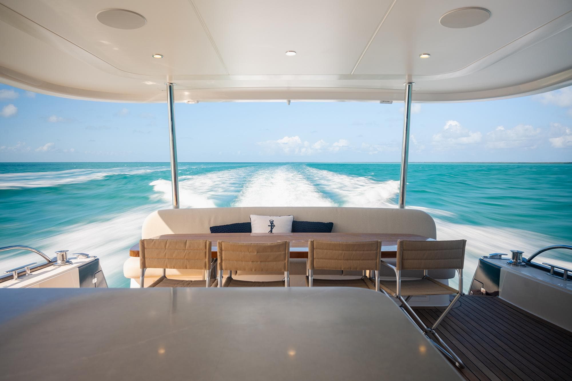 Luxury Grand Banks GB 85 yacht cruising on turquoise waters, 2026 model.