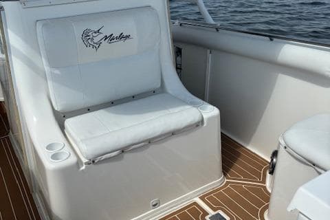 2004 Marlago FS35 boat interior with cushioned seating and wooden flooring.