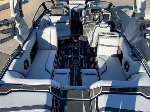 2024 Supra SV 550 boat interior with luxurious seating and modern dashboard.