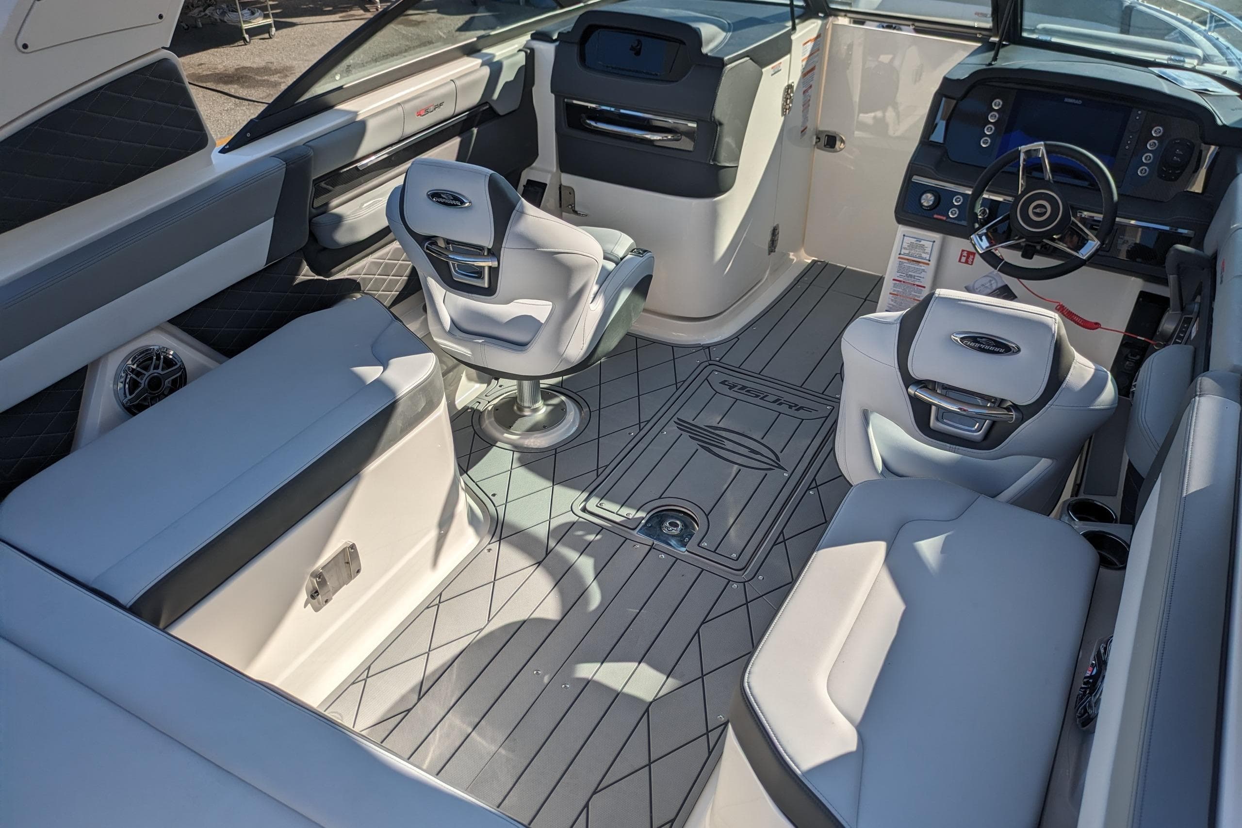 Luxurious interior of 2026 Chaparral 6 GTS boat with modern seating and dashboard.