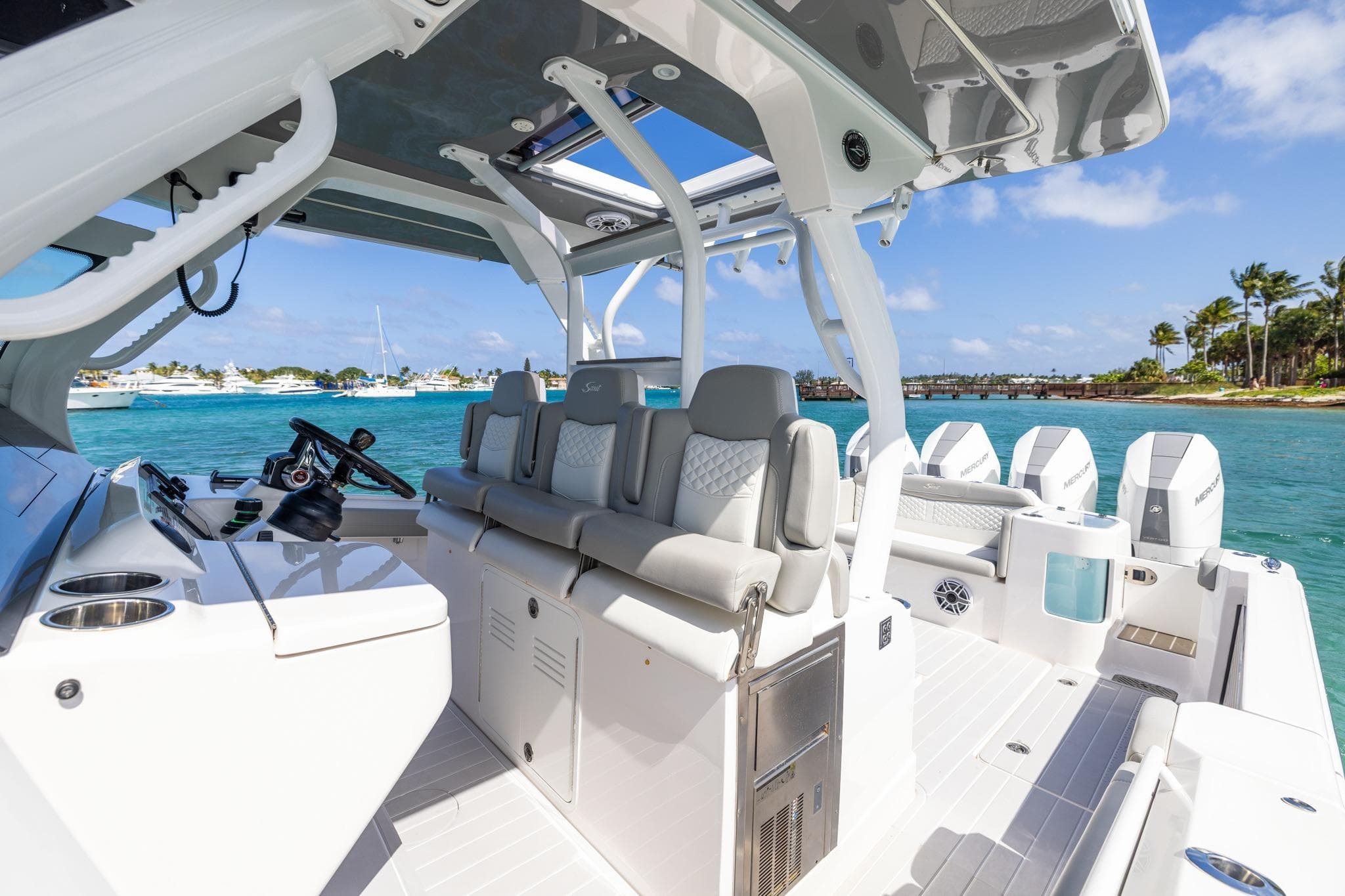 2024 Scout 400 LXF luxury boat interior with plush seating and ocean view.