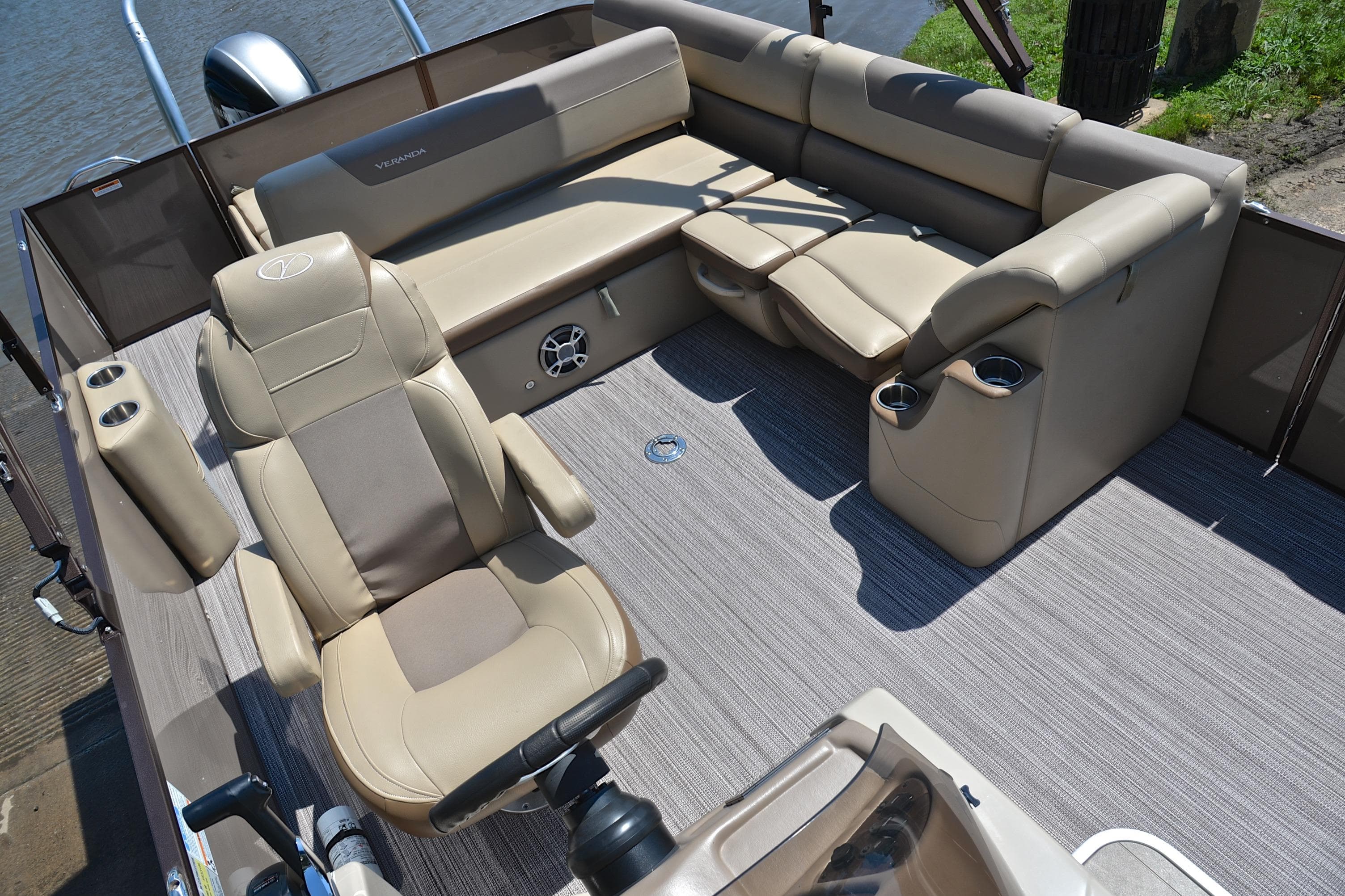 2020 Veranda VR22 pontoon boat interior with beige seating and cup holders.