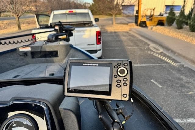 2026 Princecraft Holiday 162 WS MAX boat with Humminbird fish finder, parked near a truck.