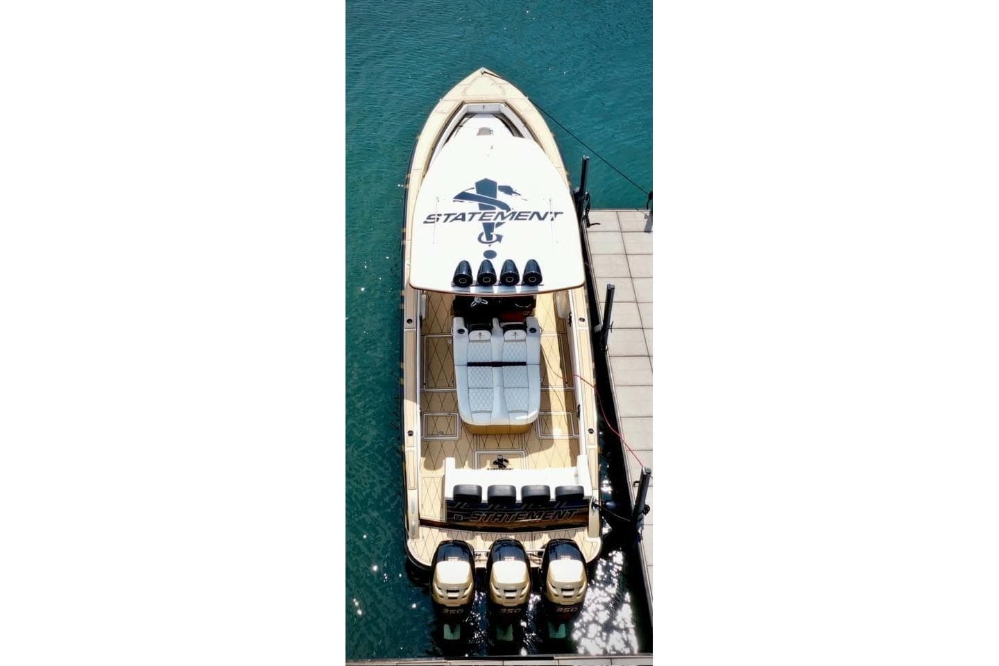 Aerial view of 2017 Statement 380 Open boat docked on clear blue water.