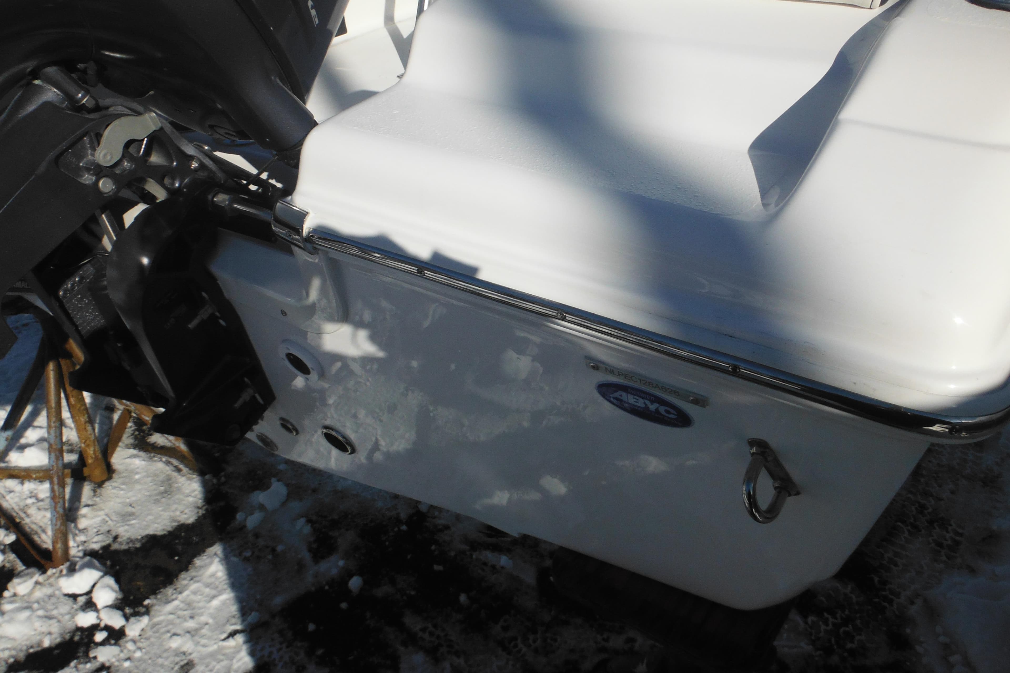 2026 Tidewater 180 CC Adventure boat rear view with snow-covered surface.