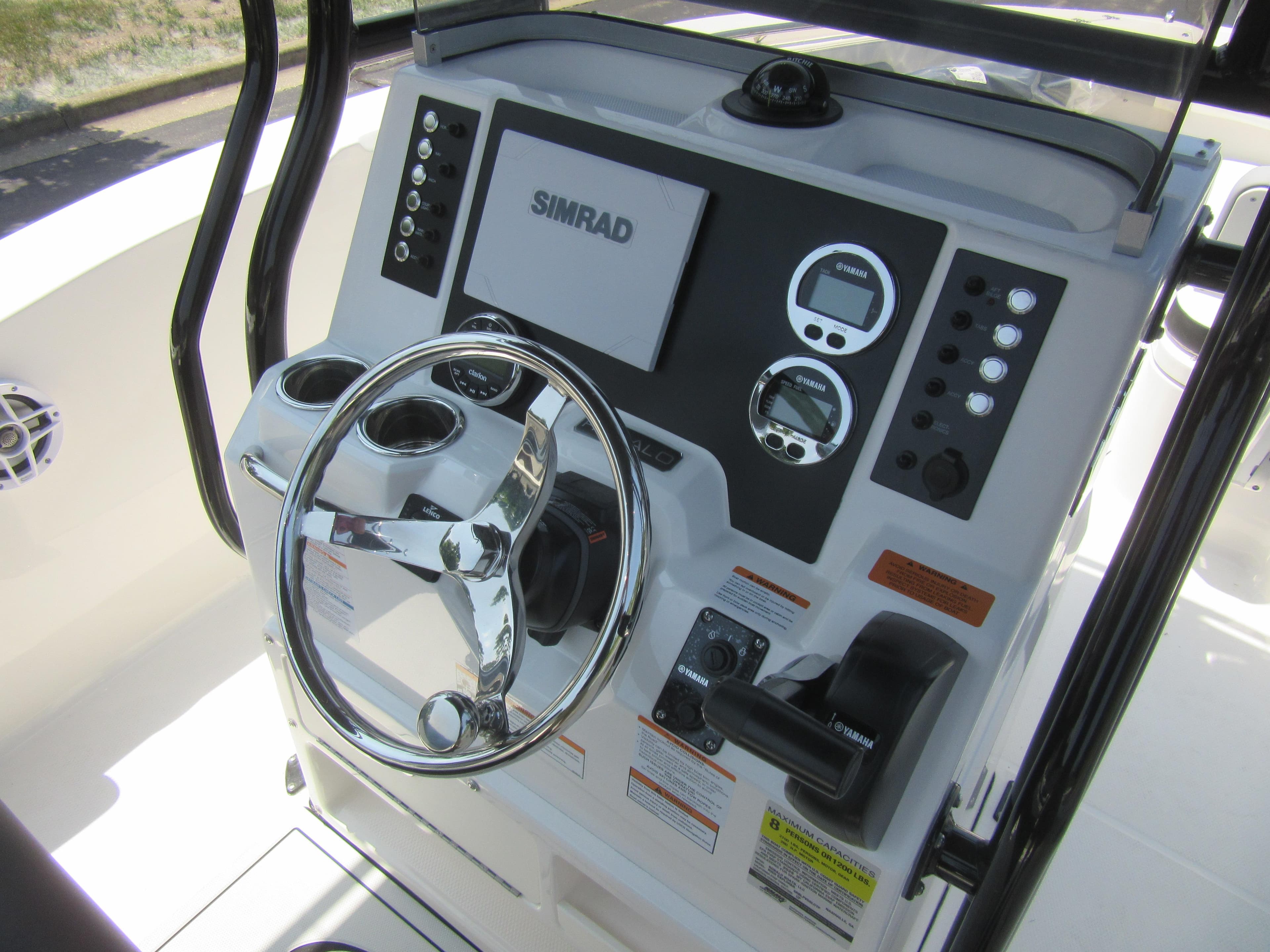 2025 Robalo R202 Explorer boat dashboard with steering wheel and control panel.
