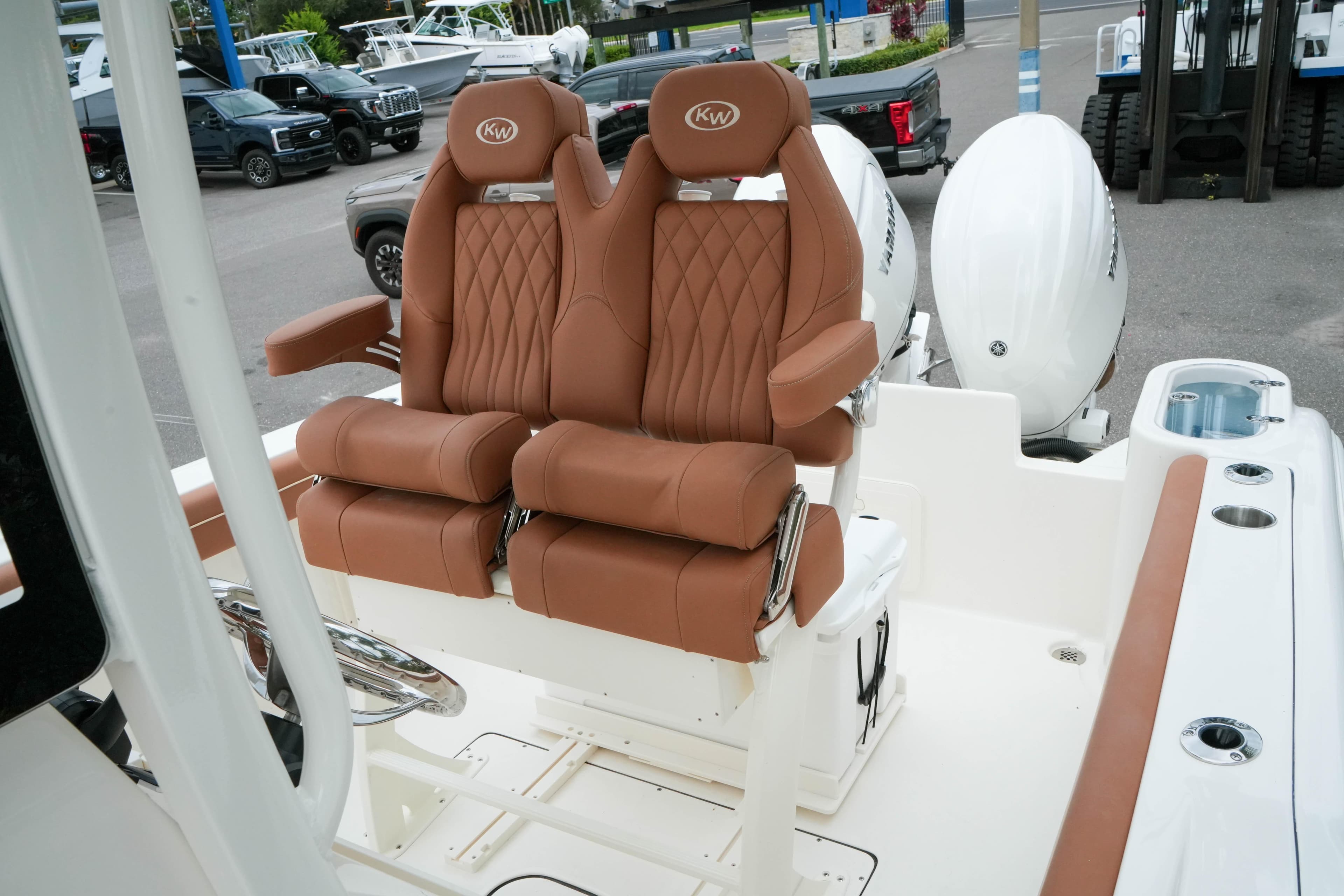 2026 Key West 244 Center Console boat with luxurious brown leather seating.