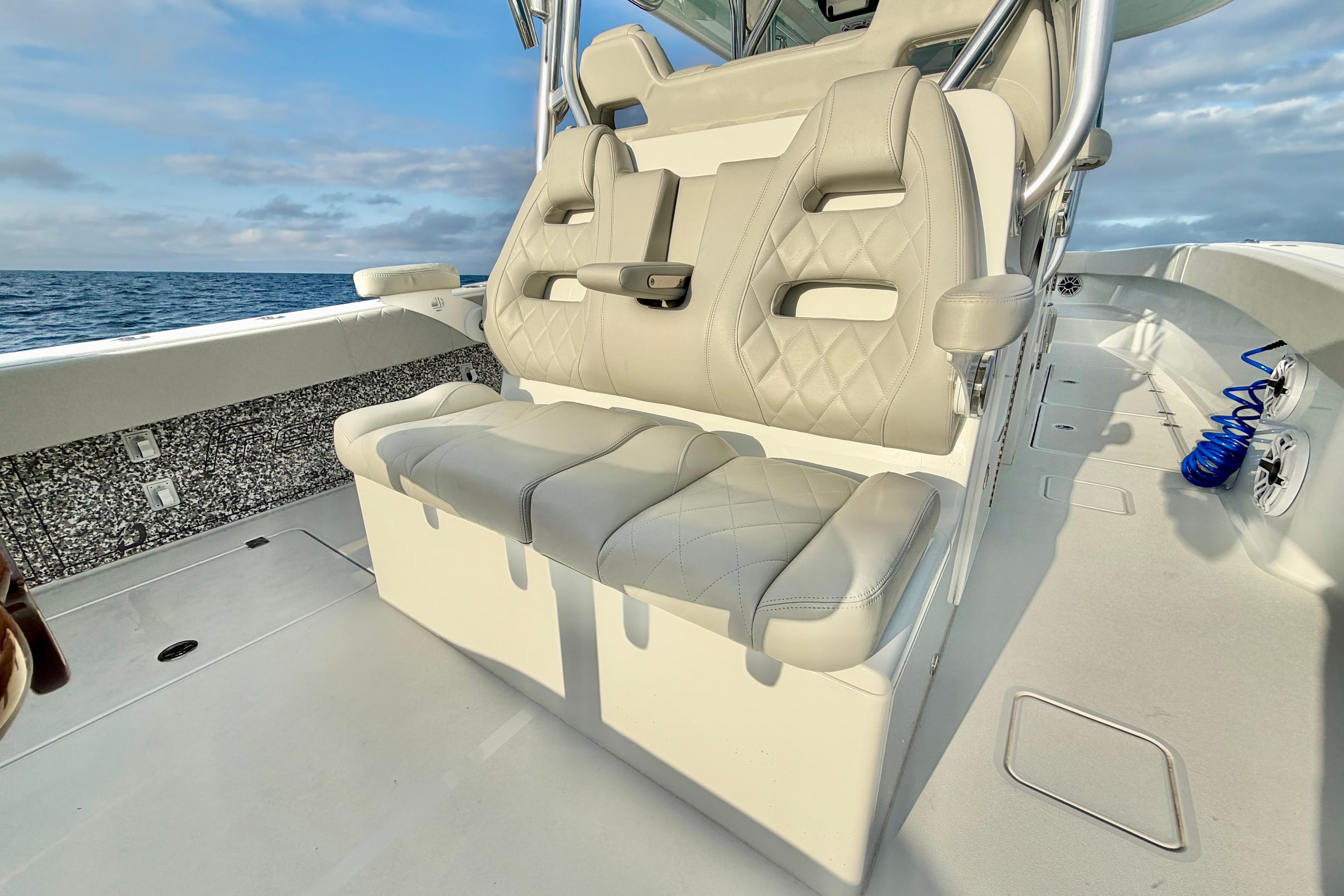Luxurious seating on 2024 Freeman 37 boat with ocean view.