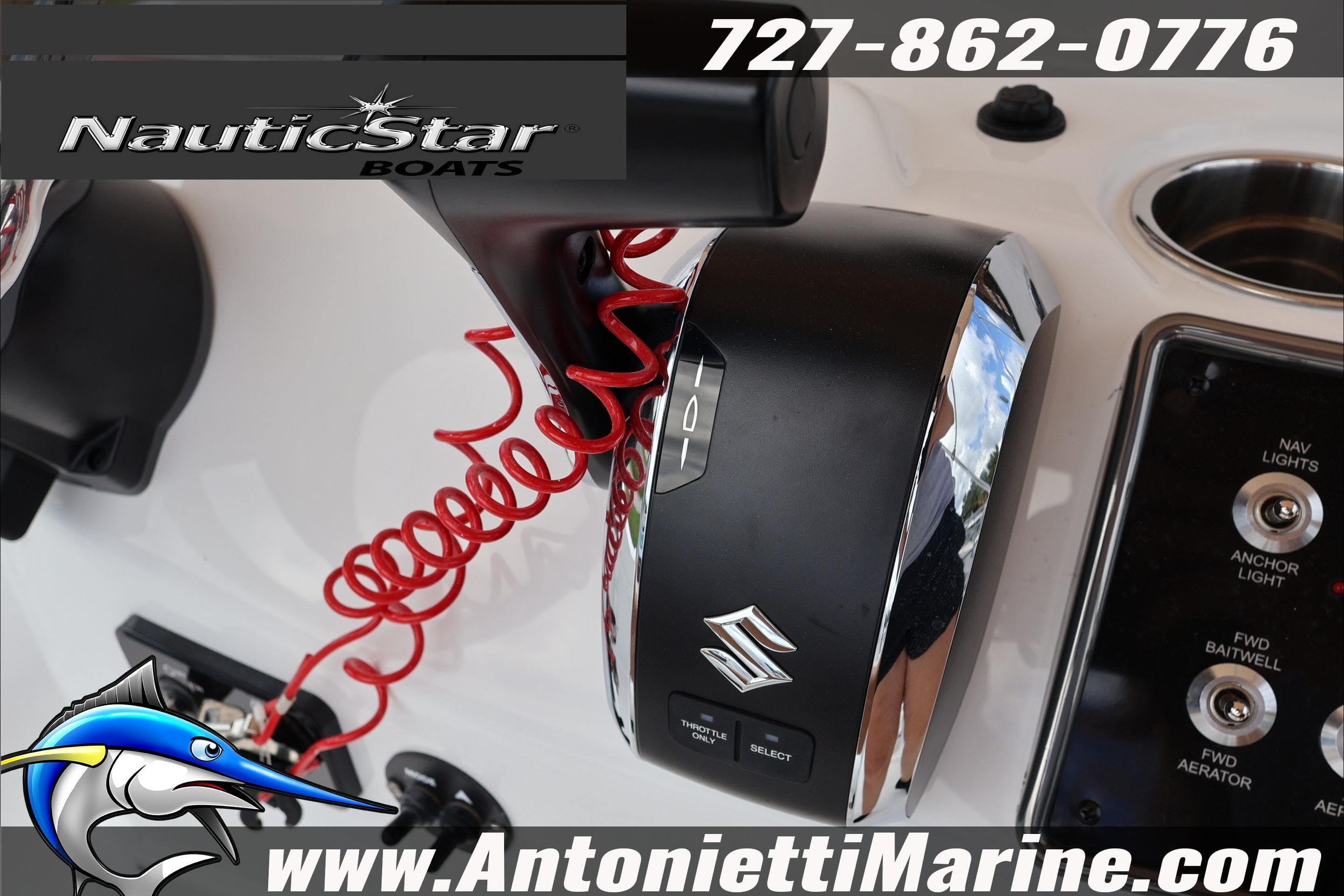 Close-up of NauticStar 191 Hybrid 2026 boat controls with Suzuki throttle and red coiled cord.