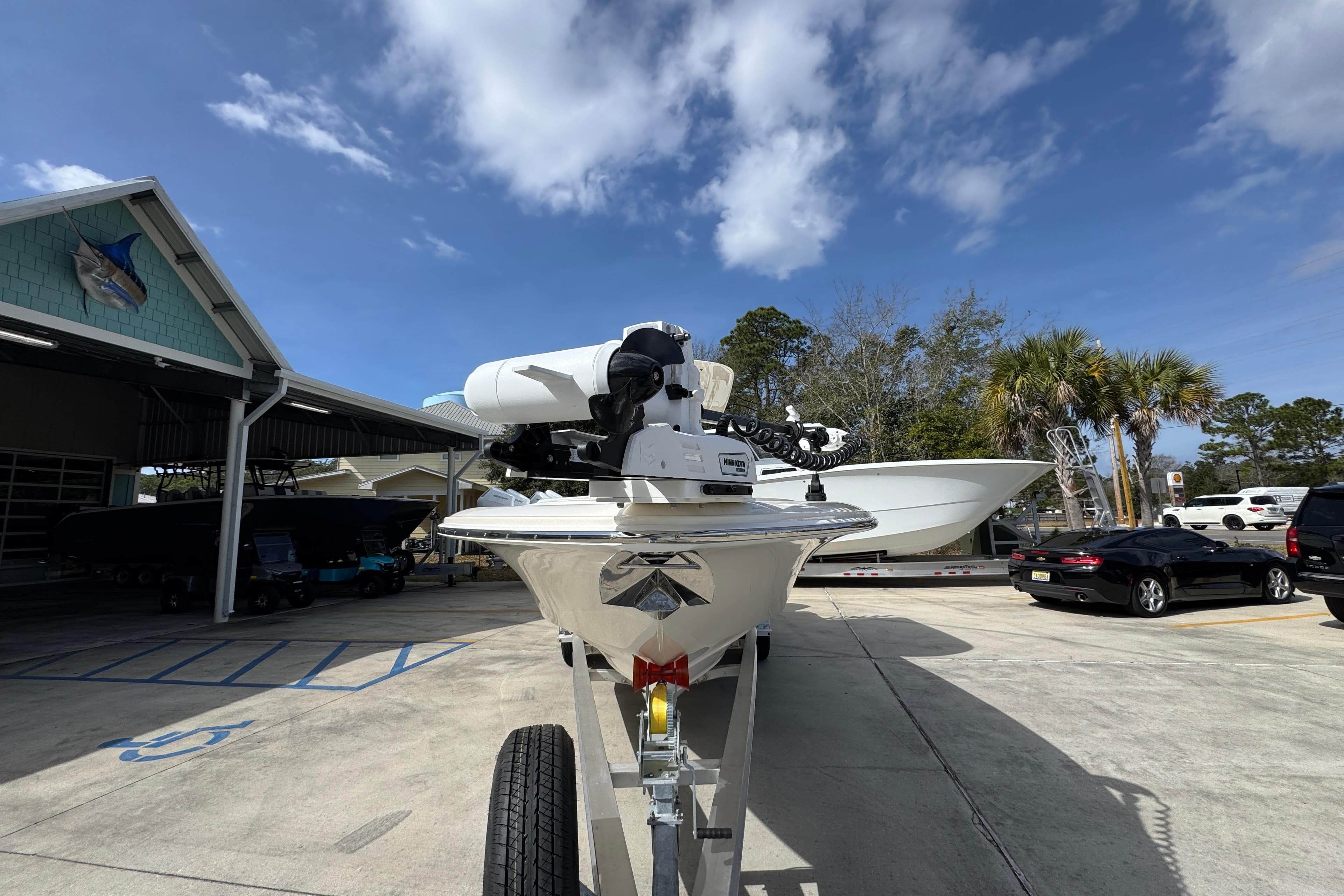2026 ShearWater 270 SS Open Carolina boat on trailer under blue sky.