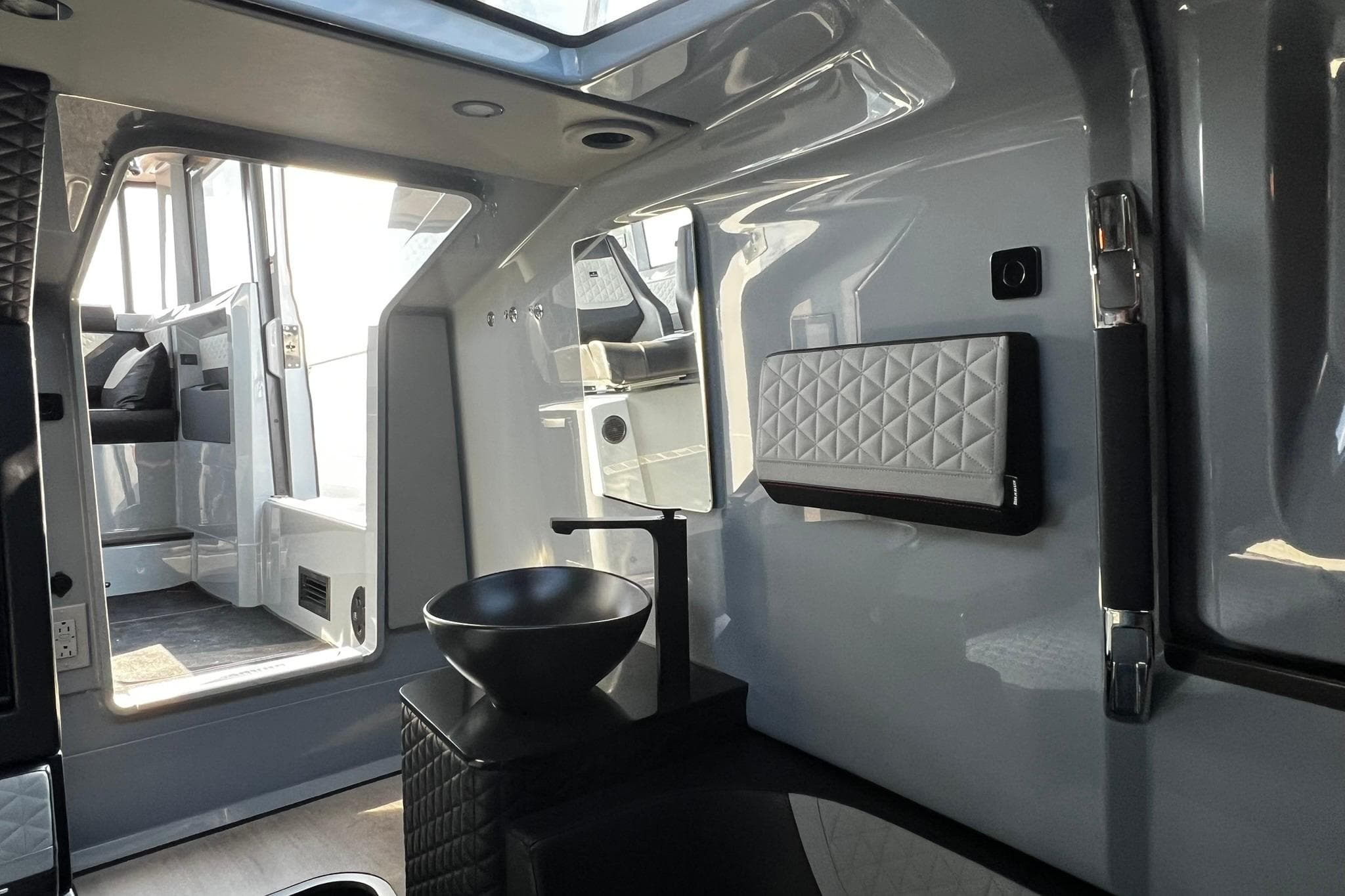 Luxurious interior of 2024 BRABUS Shadow 900 XC Cross Cabin with modern design elements.