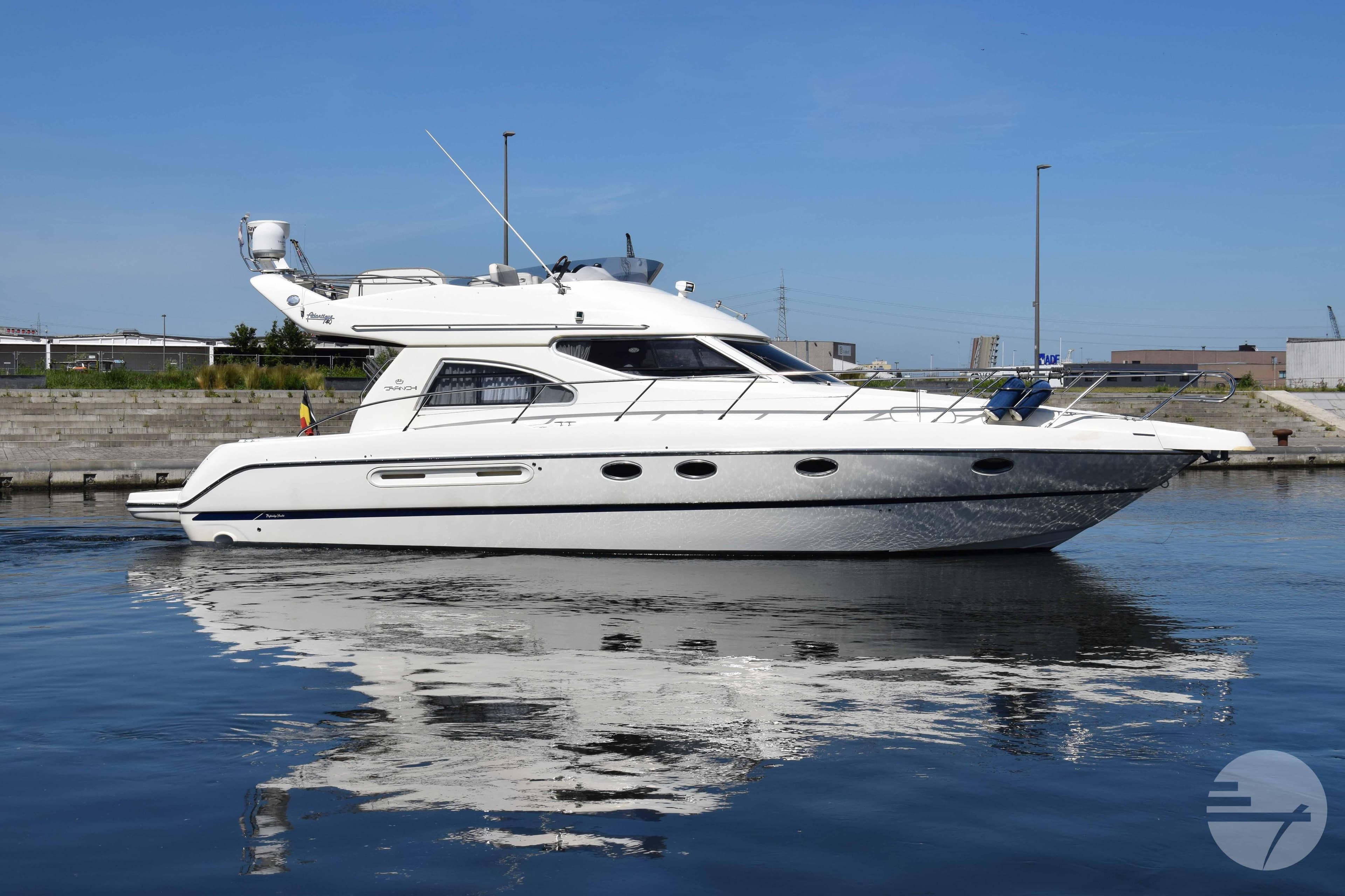 2007 Cranchi Atlantique 40 yacht on calm water, showcasing sleek design and modern features.