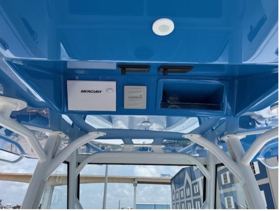 2022 Yellowfin 39 Offshore boat interior with blue ceiling and electronic controls.