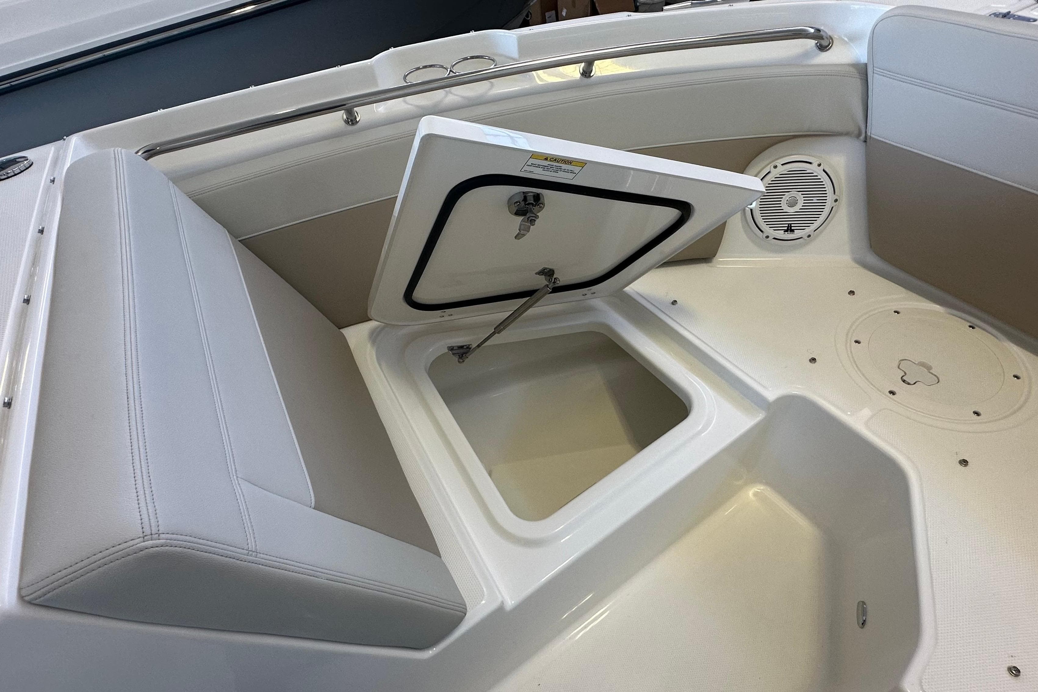 2026 Boston Whaler 210 Vantage boat interior with open storage compartment.