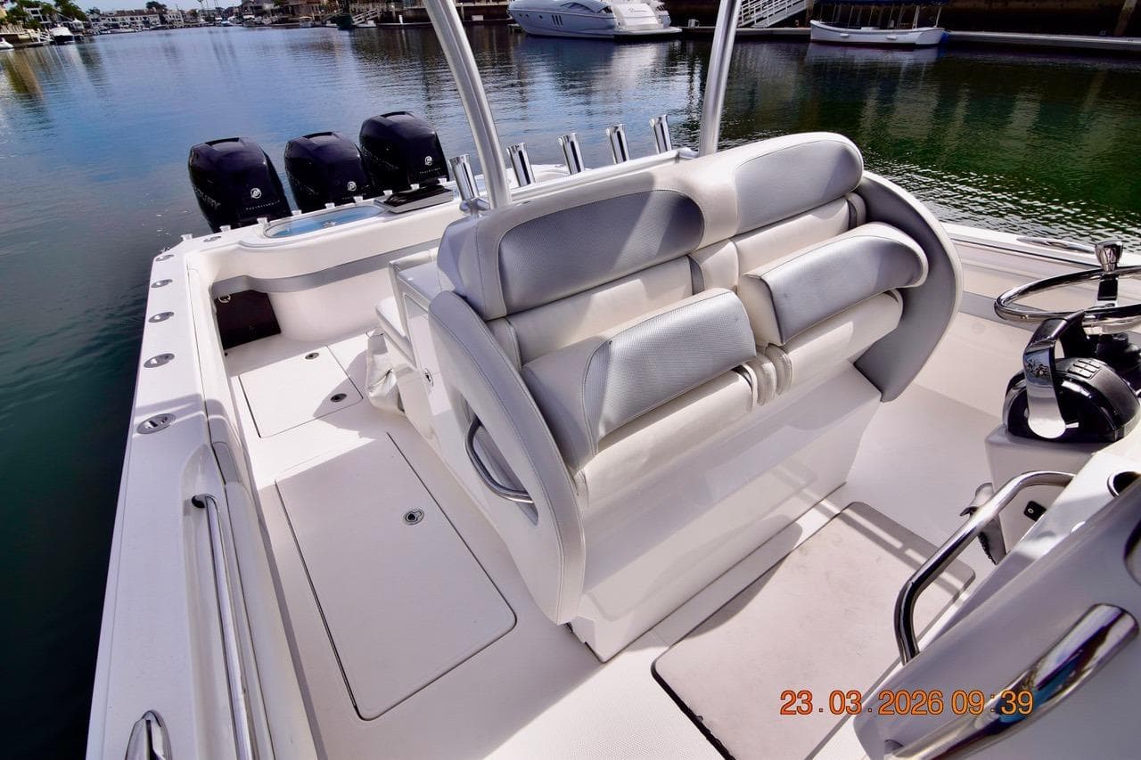 2014 Nor-Tech 392 Super Fish boat interior with seating and triple outboard motors.