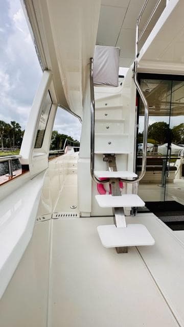 2022 Greenline 48 Flybridge yacht with hardtop, featuring sleek exterior and modern design elements.