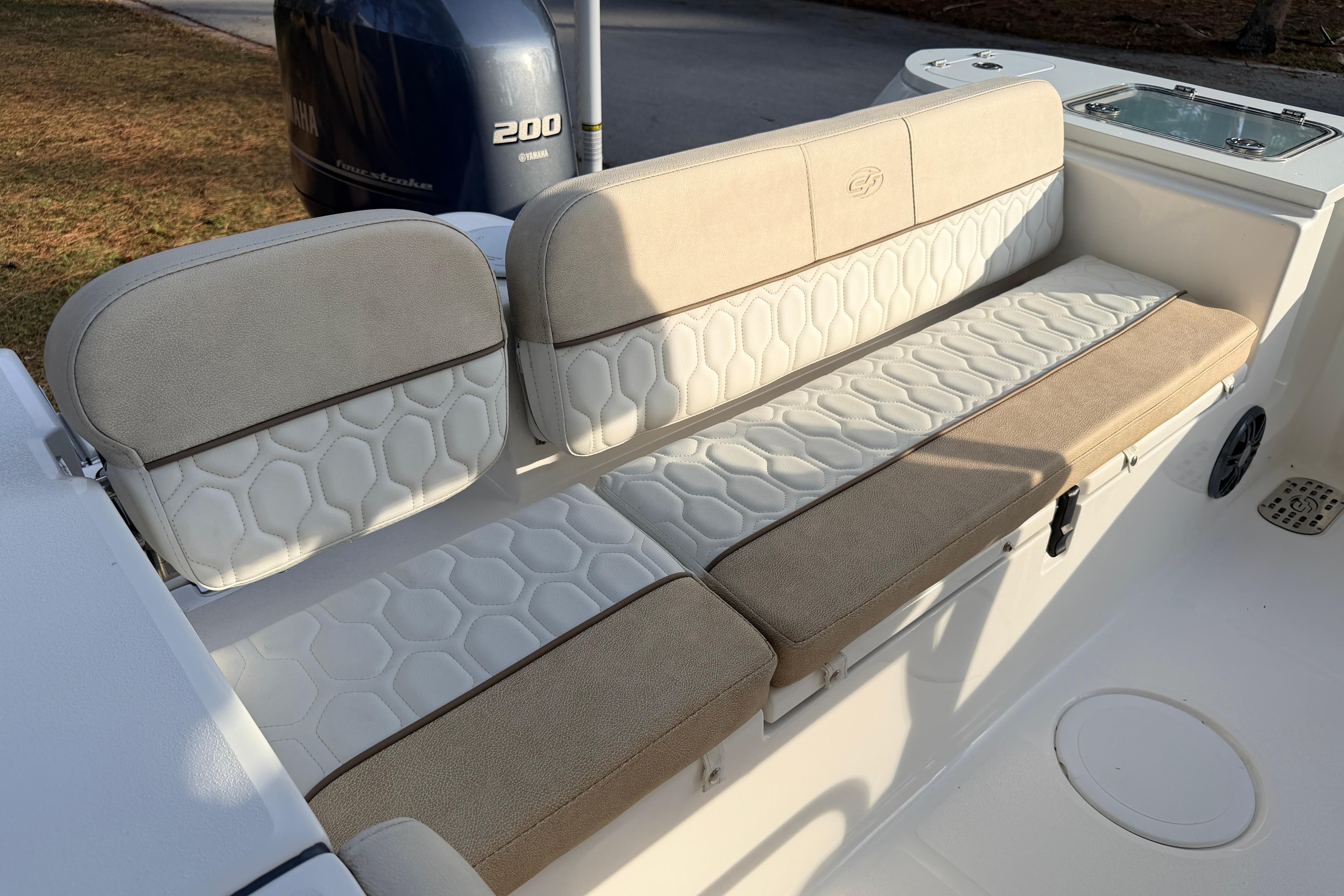 2022 Sea Fox 228 Commander boat seating with beige and white upholstery.