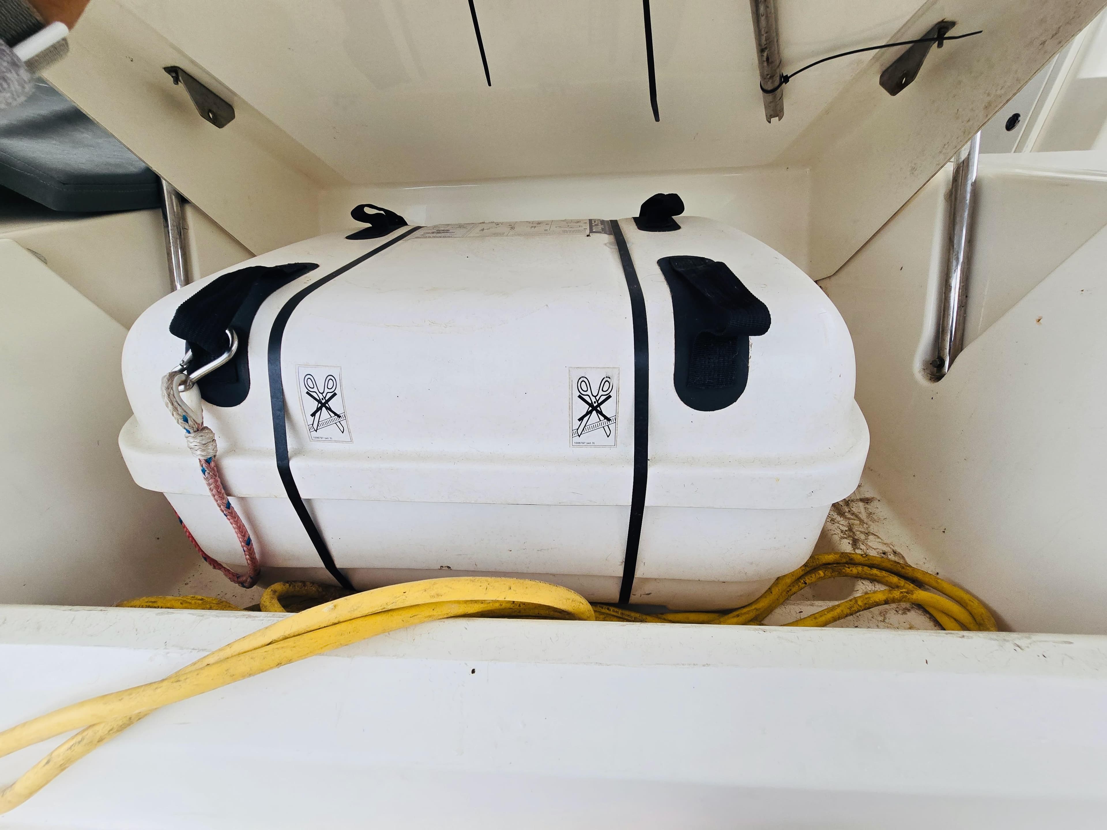 Safety equipment storage on 2018 Leopard 45 yacht, featuring a secured white container.