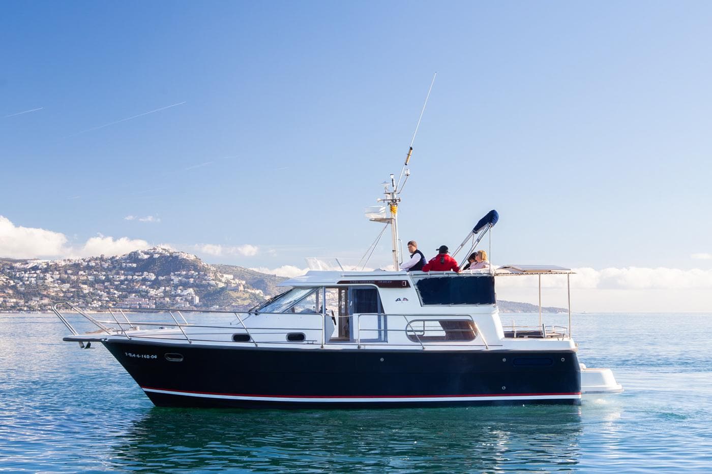 Nimbus 380 Commander 2005 yacht cruising on calm waters under a clear blue sky.